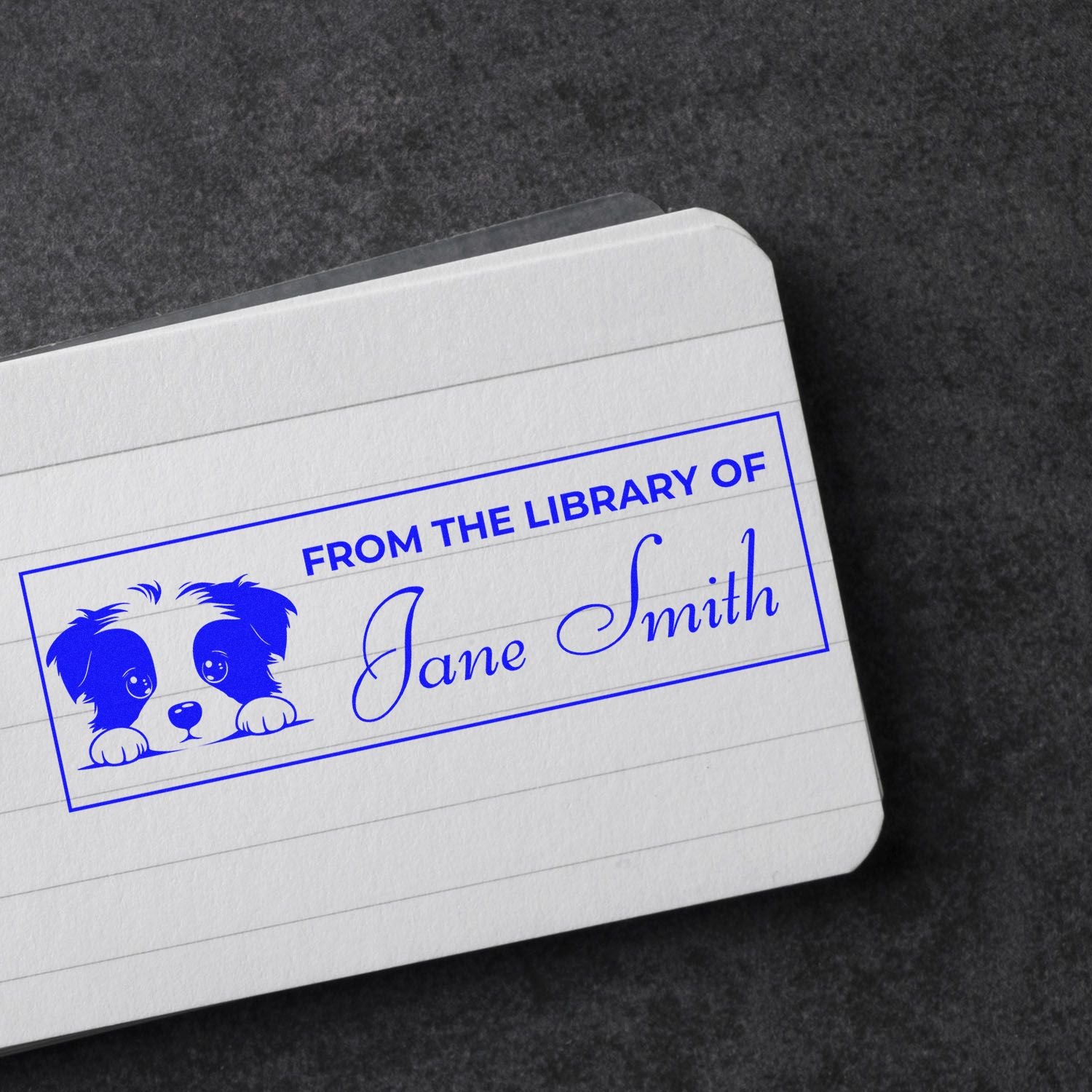 Custom rubber stamp with dog graphic and From the Library of Jane Smith for personal books, libraries, and book lovers.