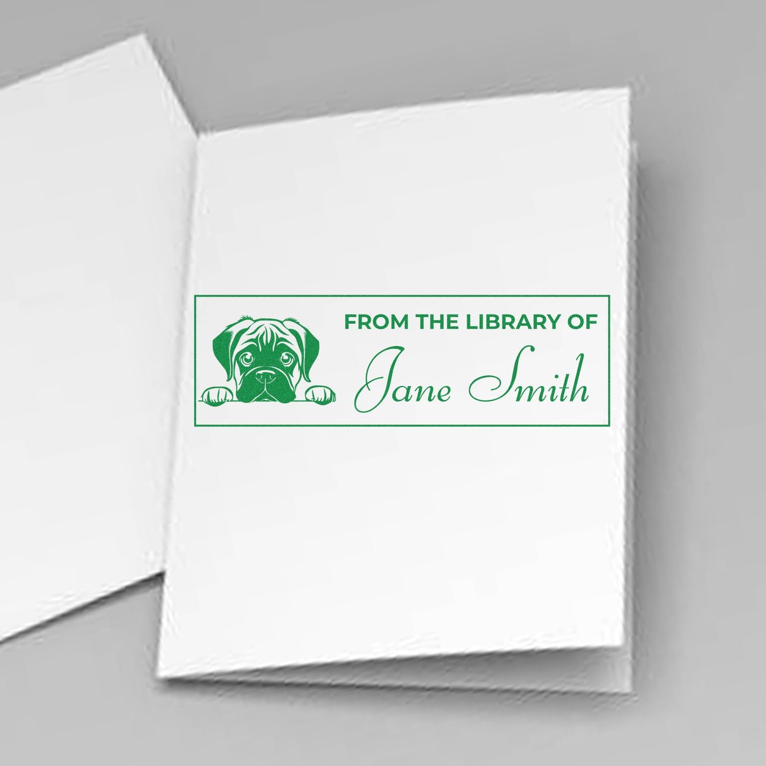 Personalized dog library rubber stamp for books, reading "From the Library of Jane Smith" with a puppy illustration.