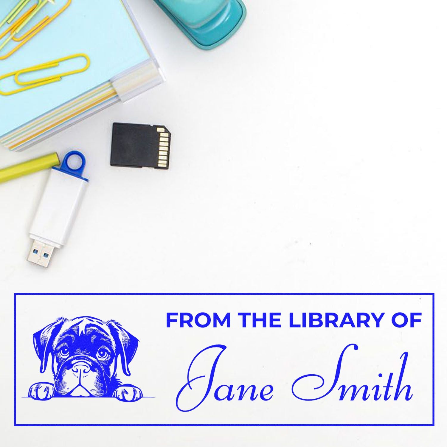Custom library rubber stamp with dog graphic and From the Library of Jane Smith text for personalized book labeling.