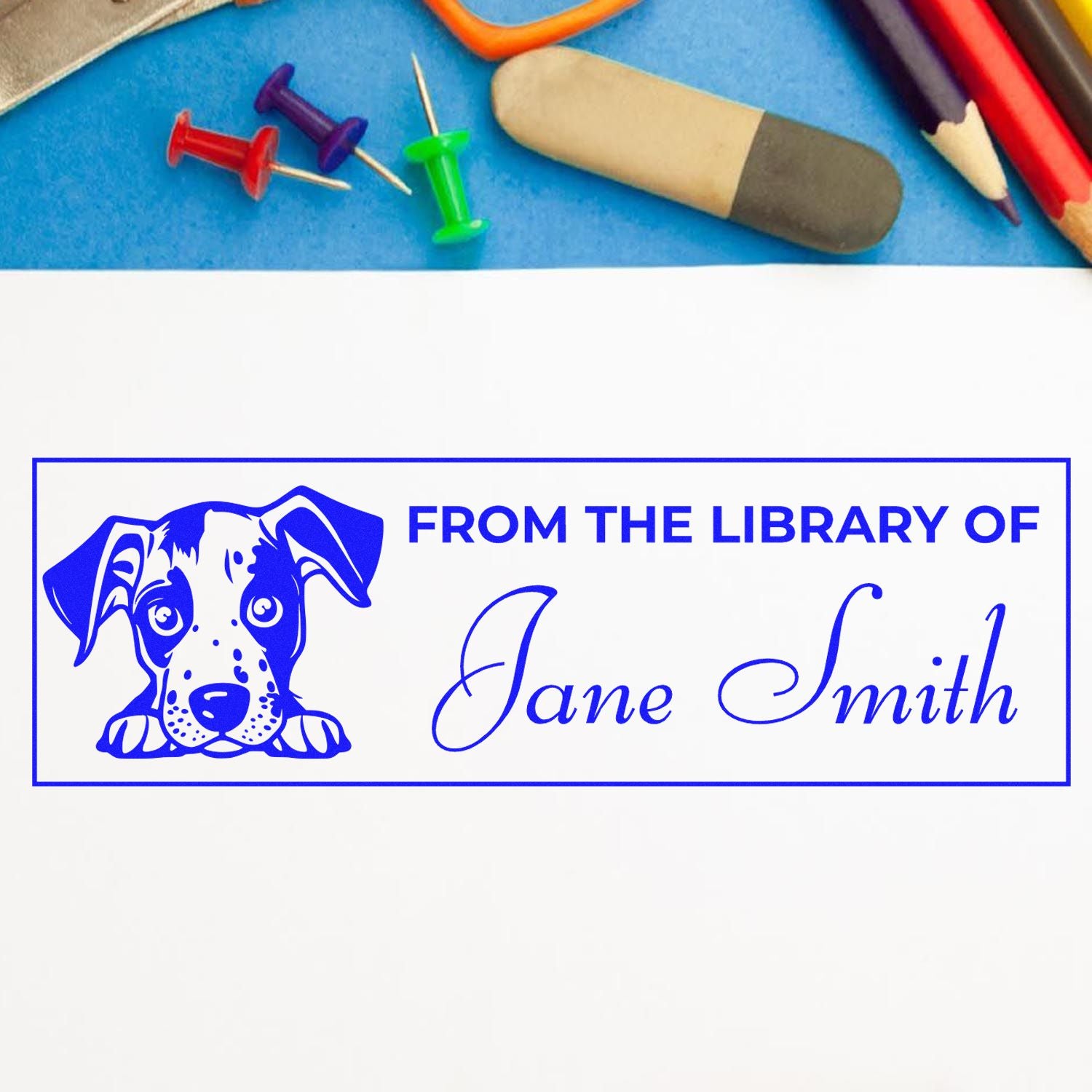 Custom library rubber stamp with dog illustration and From the Library of Jane Smith for personalized books and stationery.