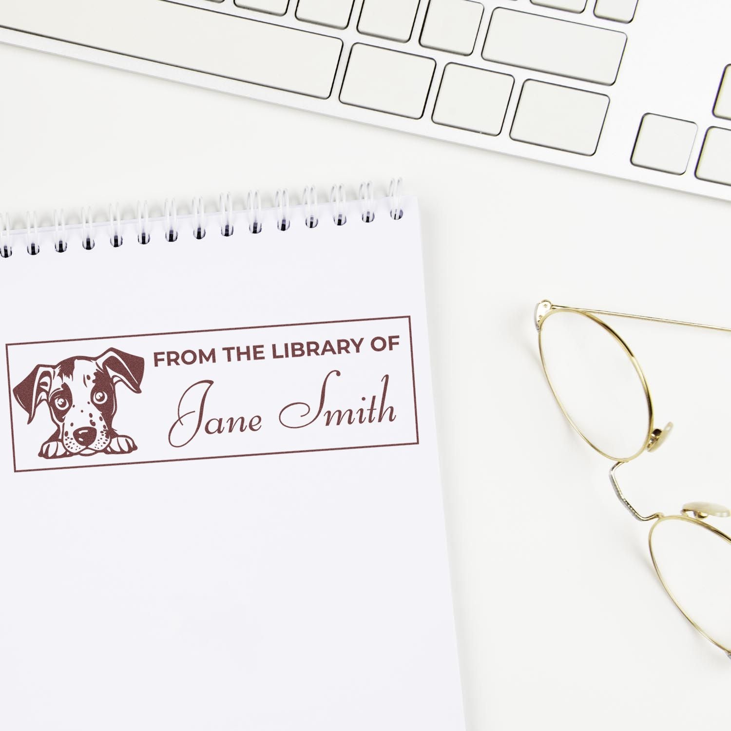 Custom rubber library stamp with dog design and Jane Smith name, perfect for personalizing books and notebooks.