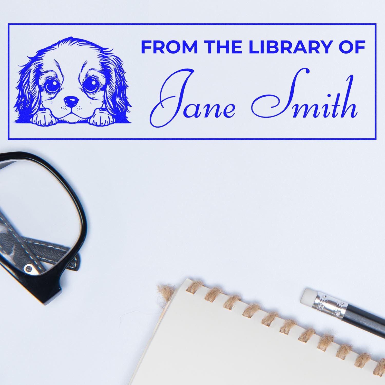 Custom library rubber stamp with dog illustration and From the library of Jane Smith text for personalized book marking.