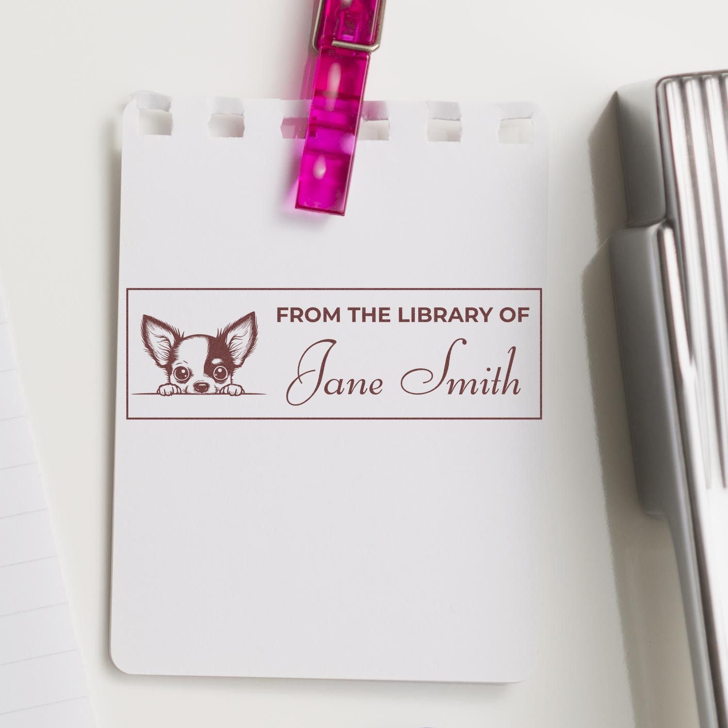 Personalized library book rubber stamp with dog illustration and Jane Smith name, used to mark books from your library.