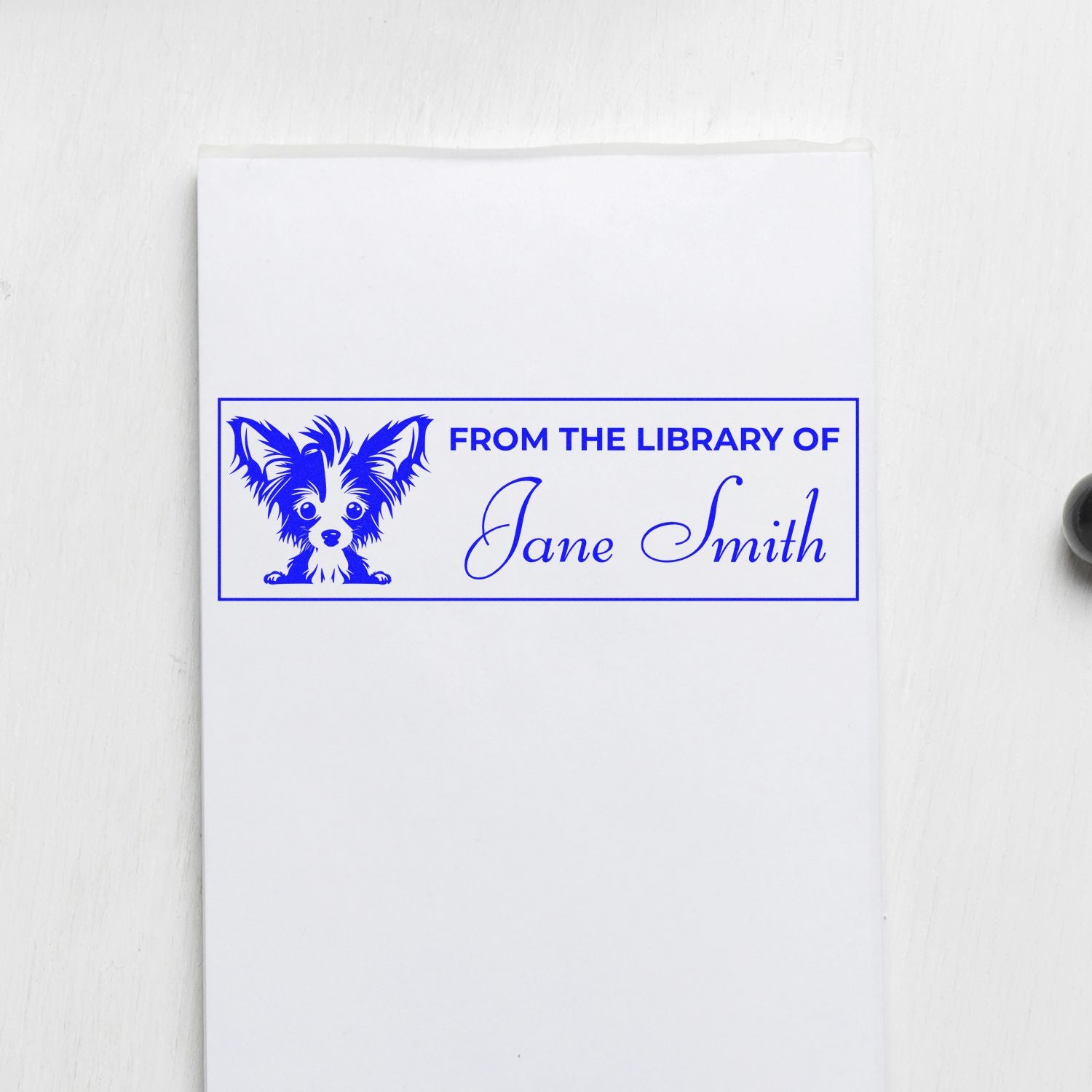 Personalized library rubber stamp with dog design and From the Library of Jane Smith custom ex libris bookplate.