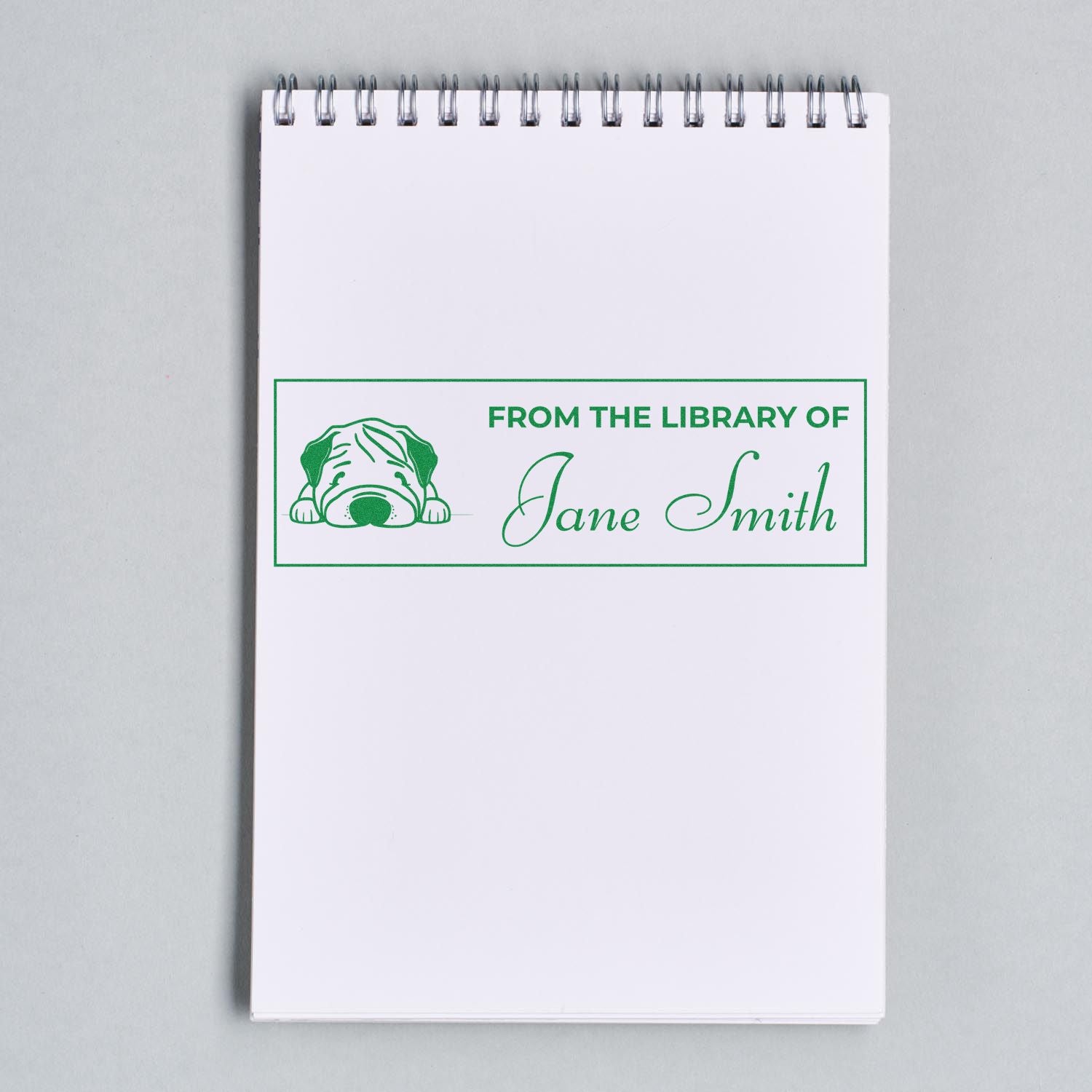 Personalized book rubber stamp with dog icon and From the Library of Jane Smith text for marking books.