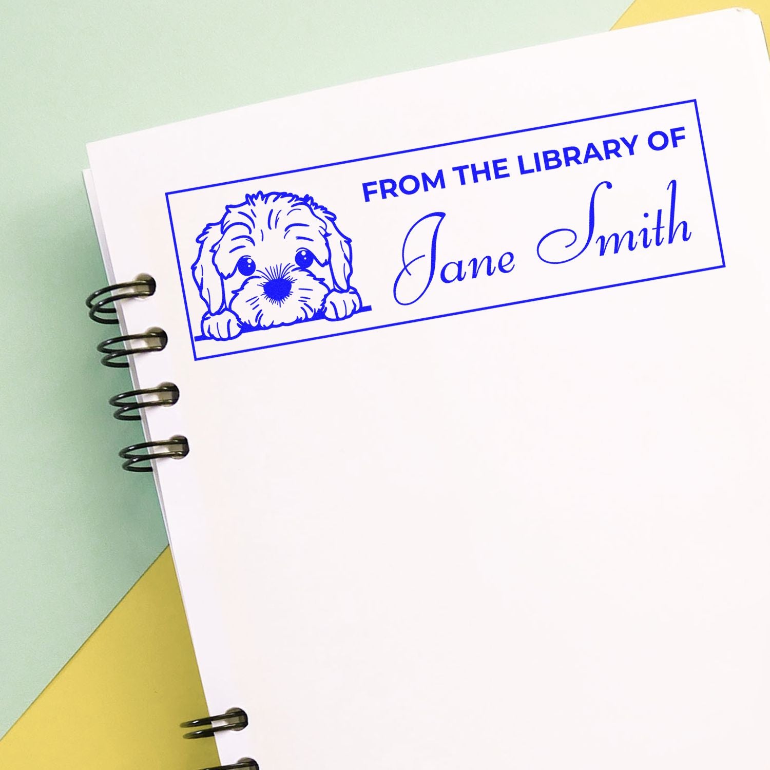 Custom rubber stamp bookplate with dog illustration and From the Library of Jane Smith text for personal library books.