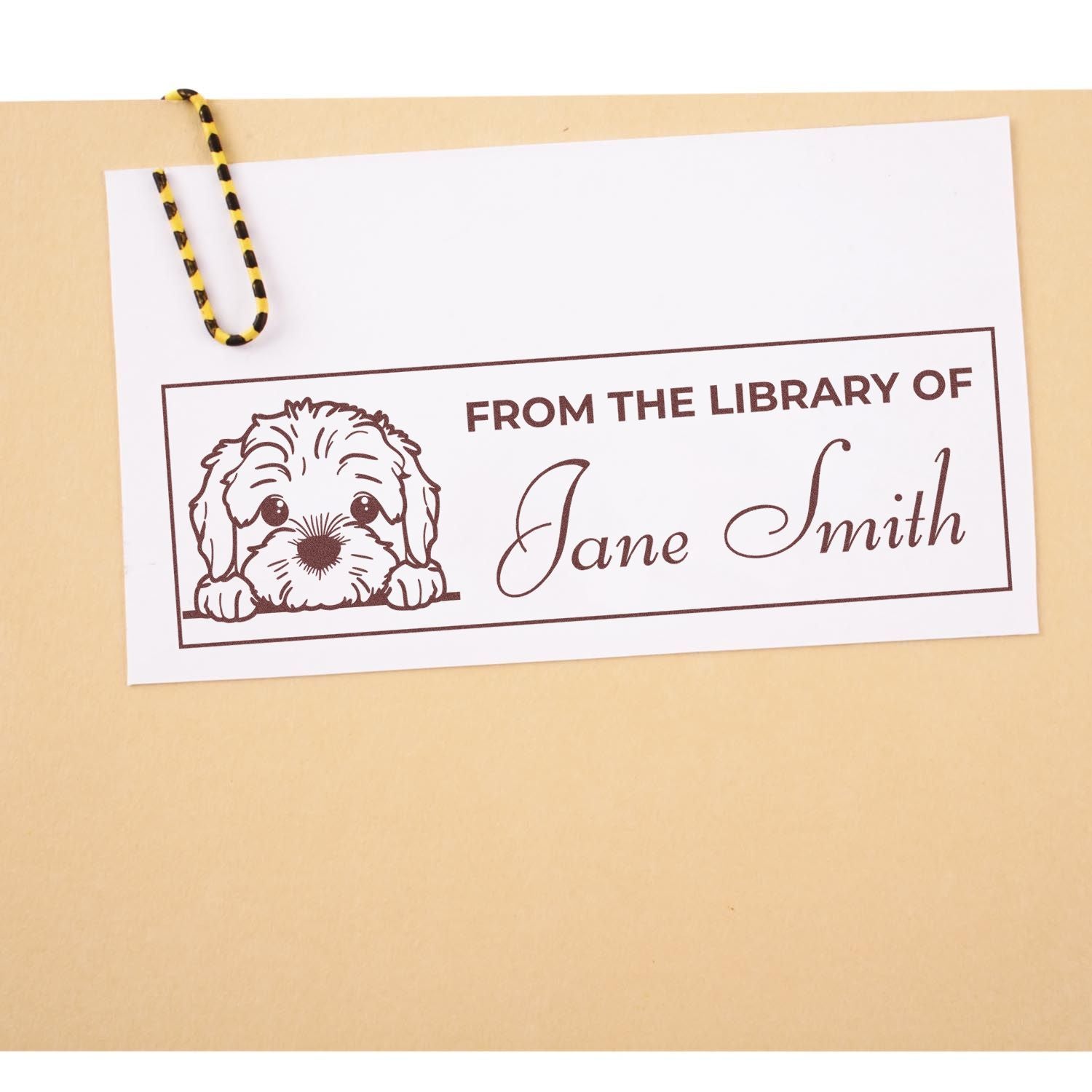 Personalized rubber stamp for books with dog illustration and From the Library of Jane Smith text for custom library labeling