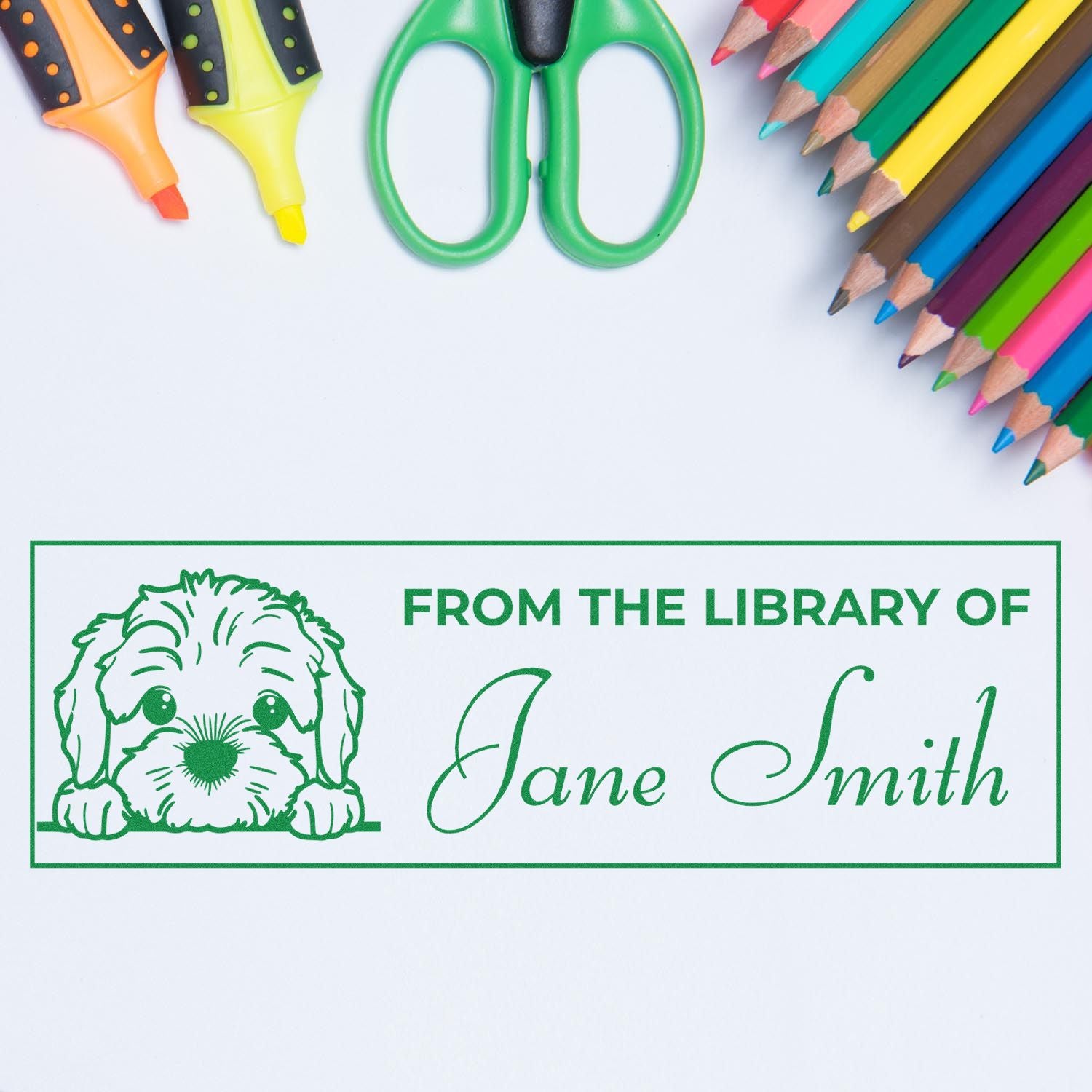 Personalized library rubber stamp with dog illustration and From the Library of Jane Smith name imprint.