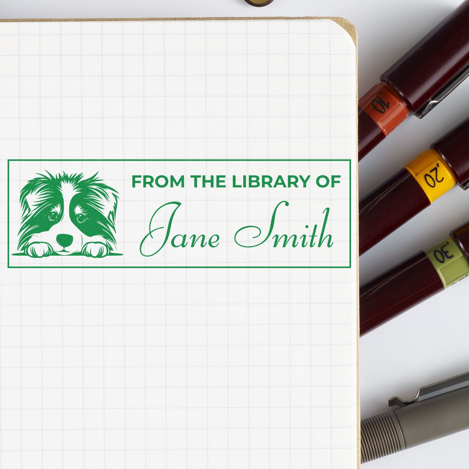 Personalized rubber stamp for books with dog art and From the Library of Jane Smith ex libris design.