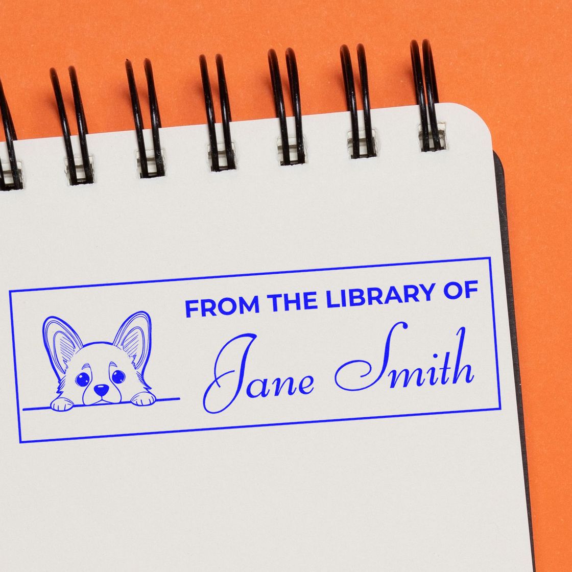 Personalized library rubber stamp with From the Library of Jane Smith and dog art for custom book labeling.