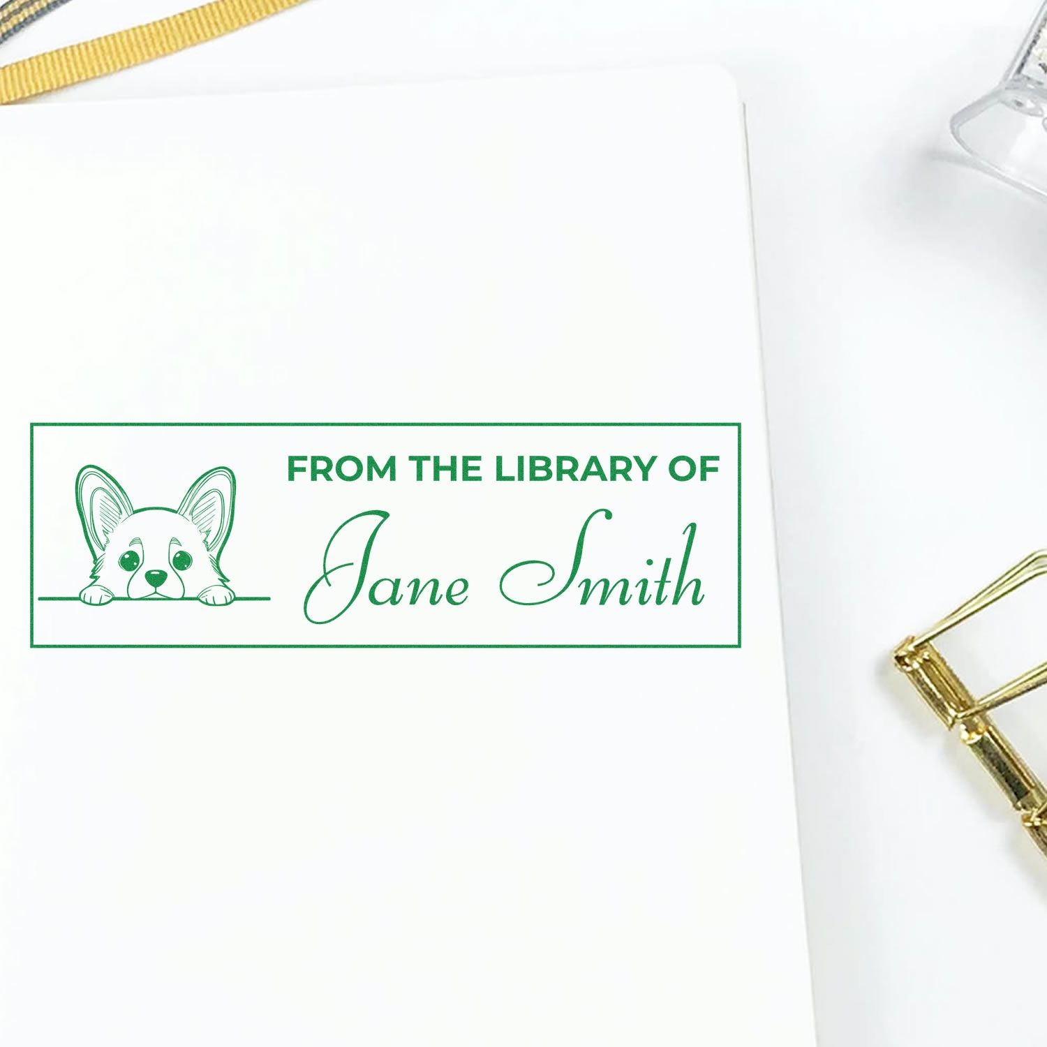 Personalized library rubber stamp for Jane Smith with dog illustration, marking book ownership.
