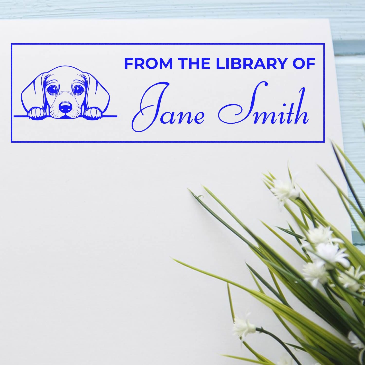 Personalized custom rubber stamp for books reading From the Library of Jane Smith with puppy illustration.