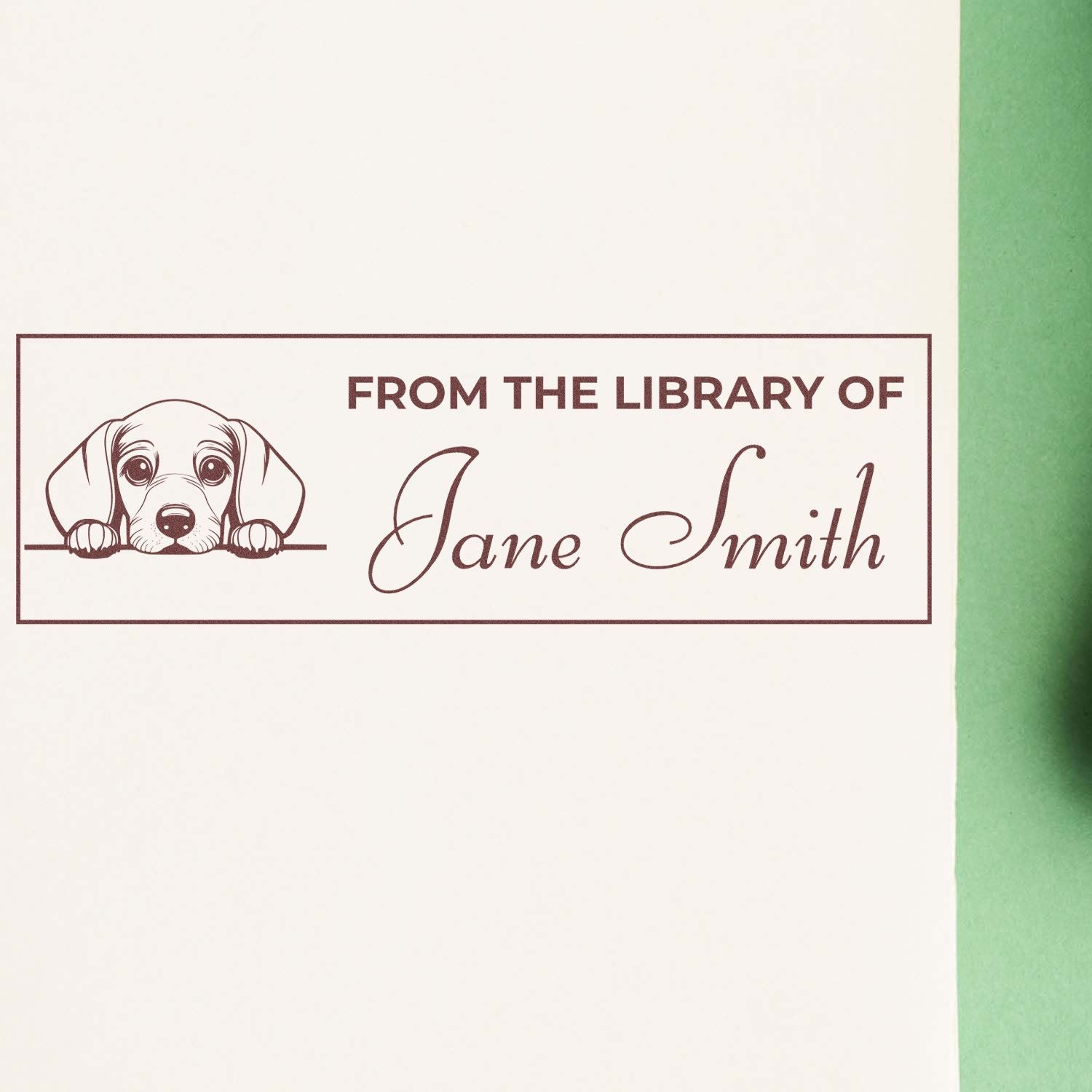 Custom rubber library stamp for books, reading From the Library of Jane Smith with a dog illustration.