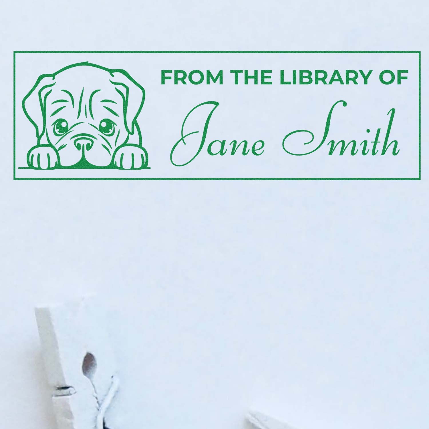 Custom personalized rubber stamp for library books with dog art and From the Library of Jane Smith text.