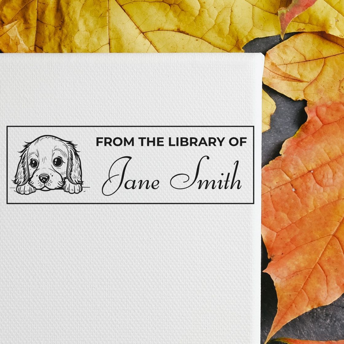 Personalized dog-themed rubber stamp reading From the Library of Jane Smith for custom bookplates.