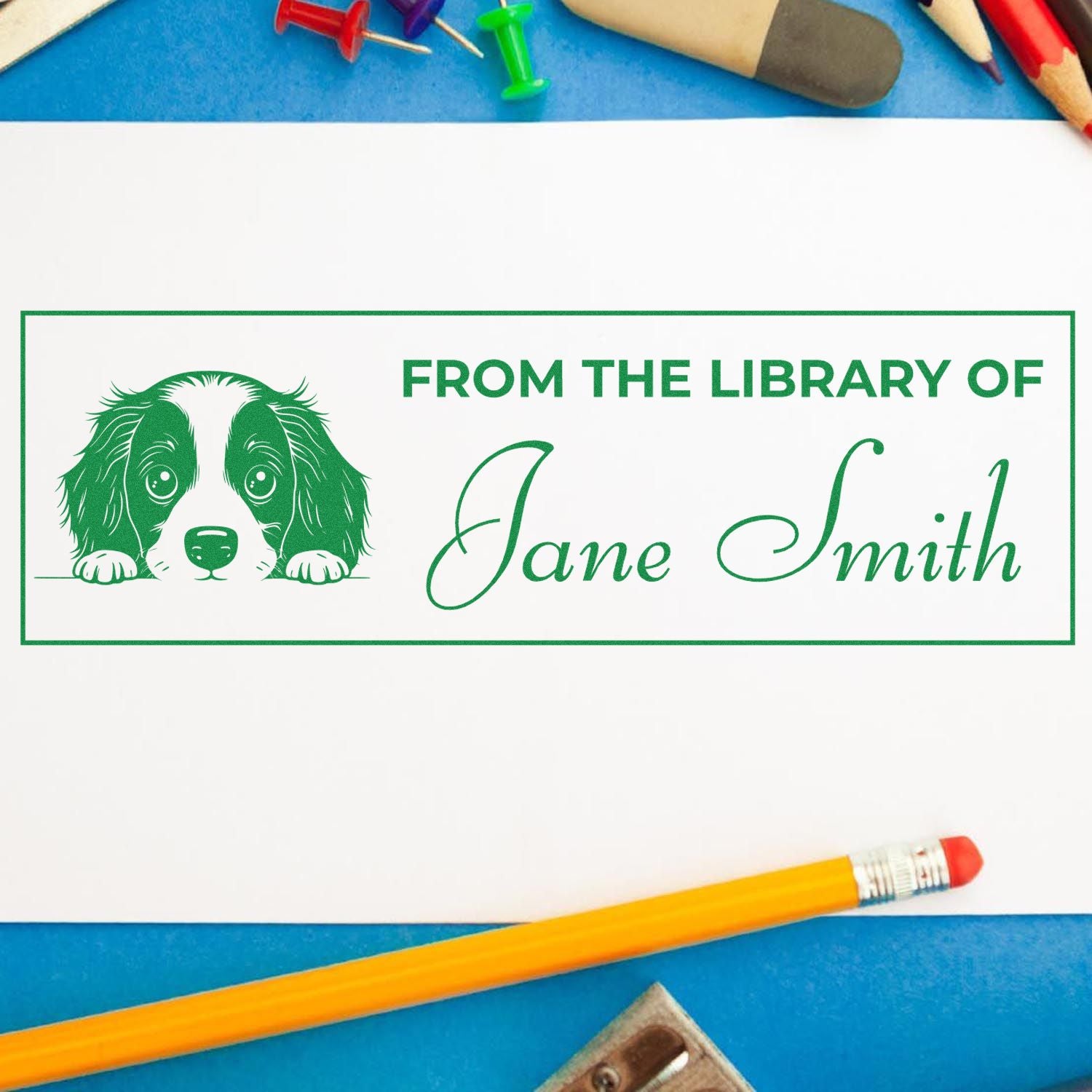Custom library rubber stamp with dog design and personalized From the Library of Jane Smith book ownership text.