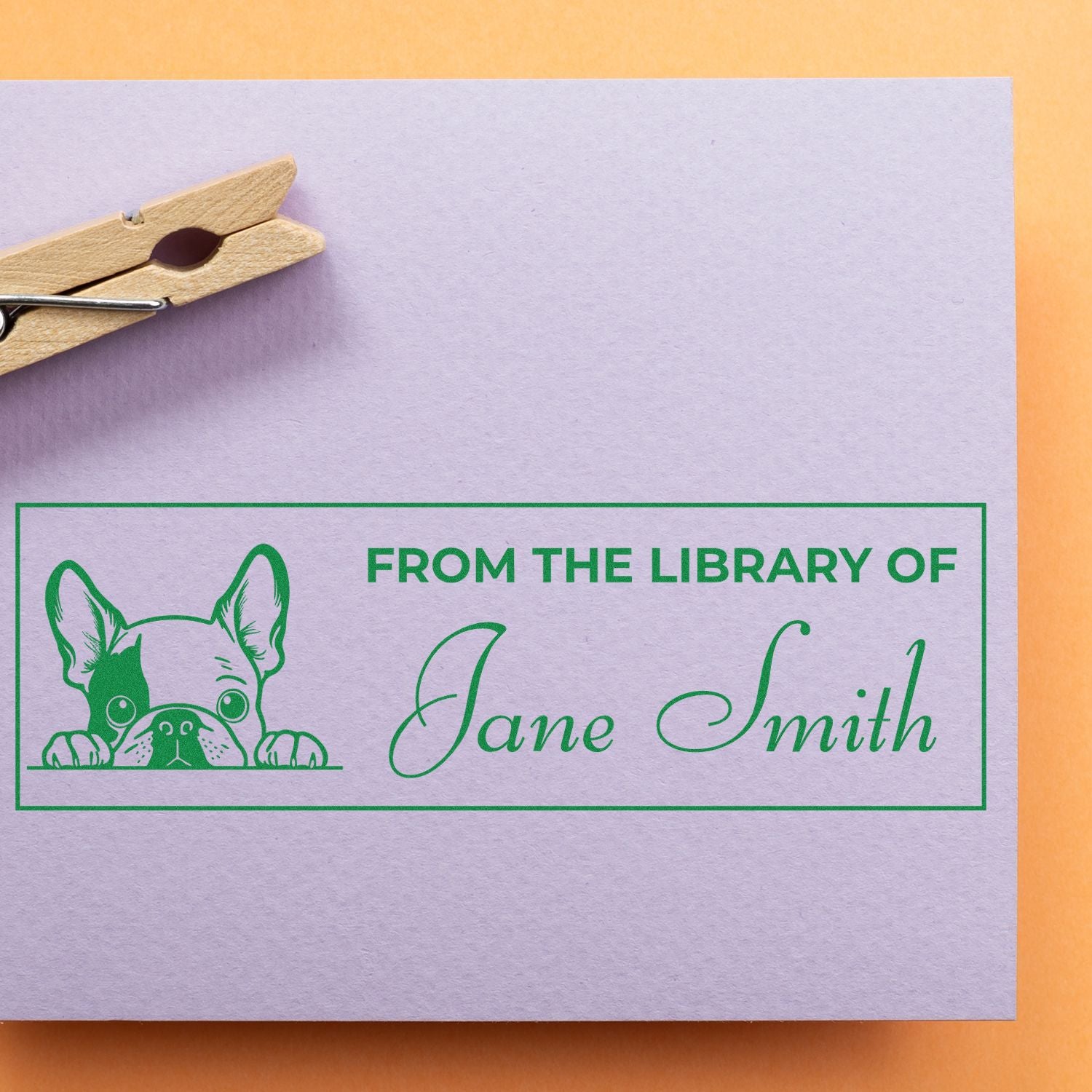 Personalized rubber stamp for books, featuring a French bulldog and custom From the Library of Jane Smith design.