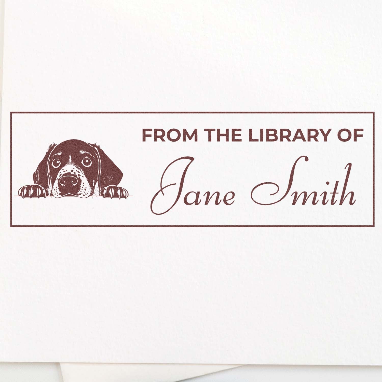 Custom dog library rubber stamp reading From the Library of Jane Smith for personalized book plates and lending marks.