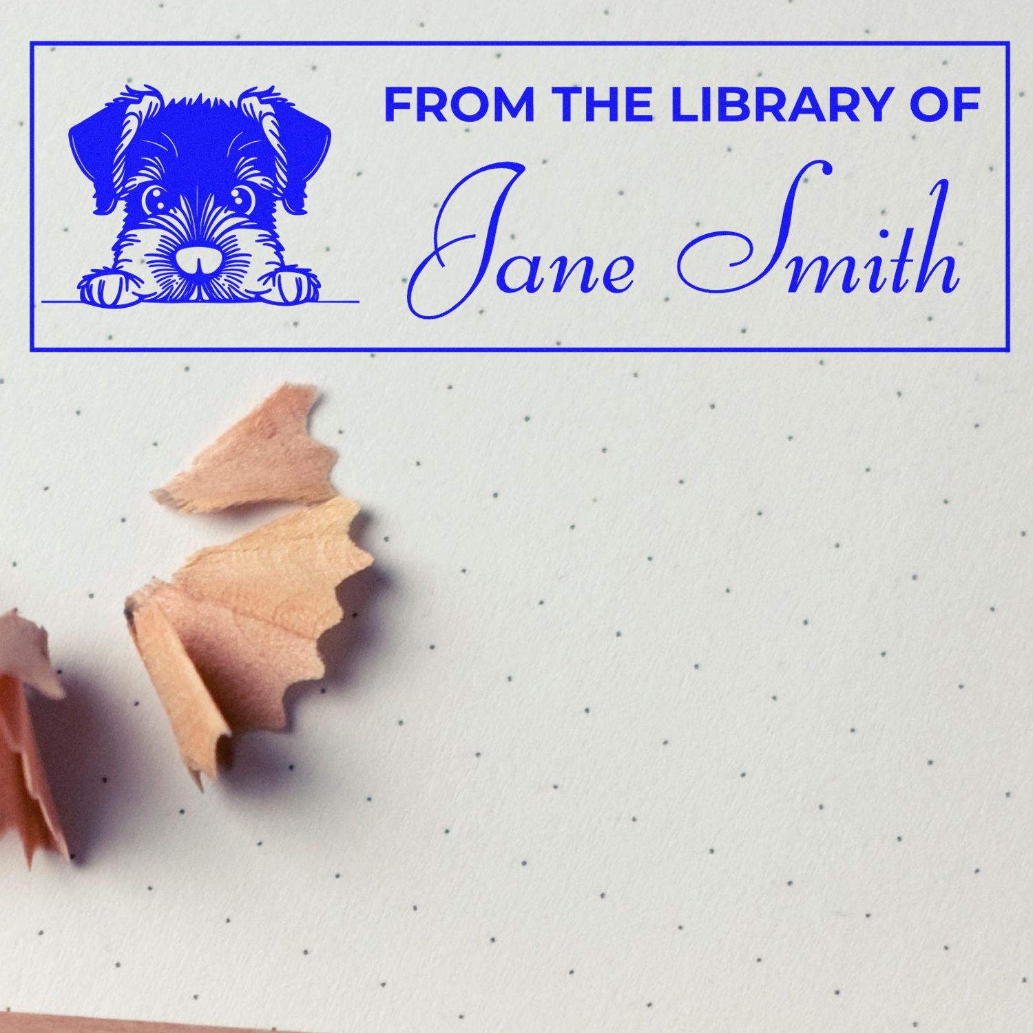 Custom rubber stamp with dog illustration and From the Library of Jane Smith text for personalized books.