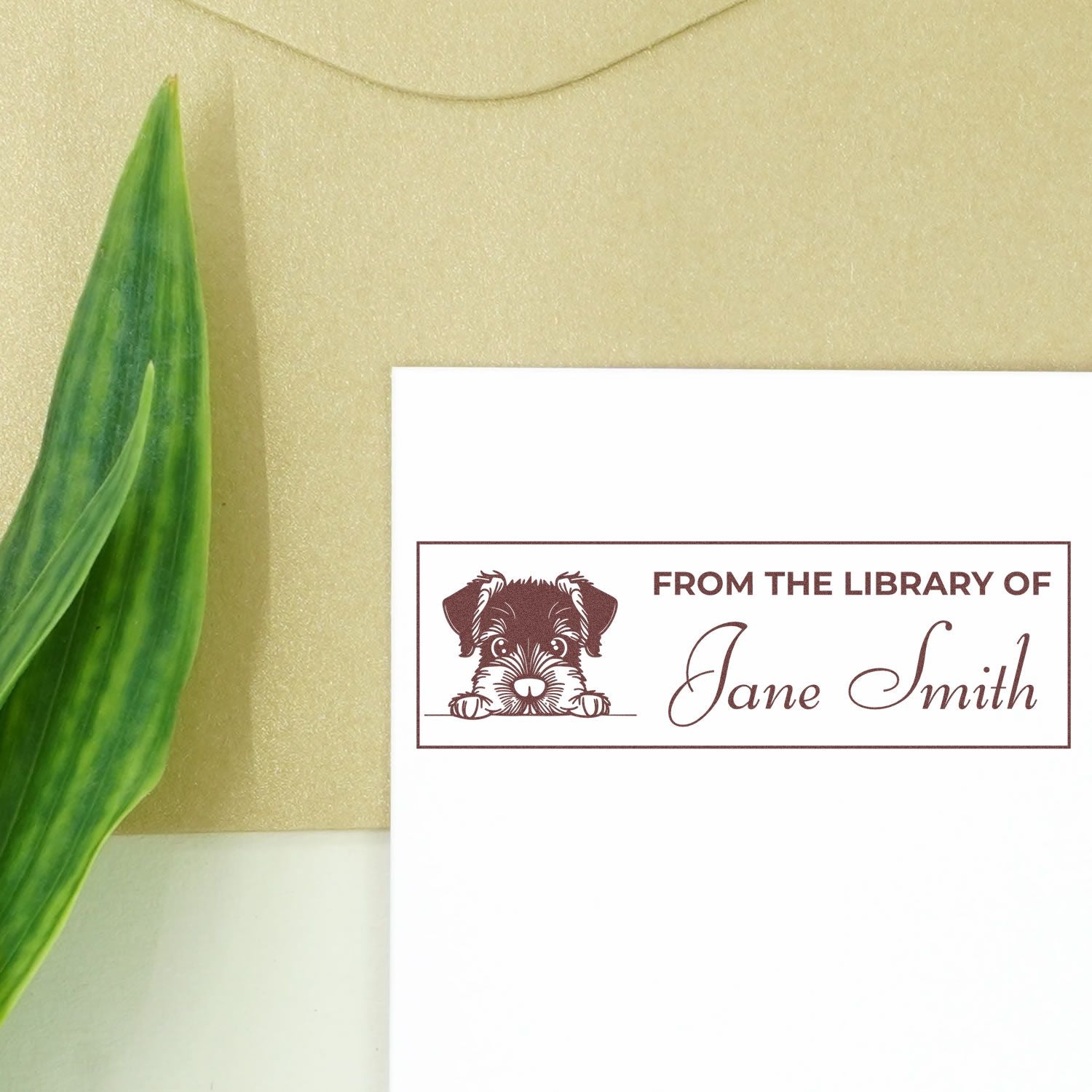 Custom From the Library of Jane Smith rubber stamp with puppy illustration for personalized bookplates and library labeling.