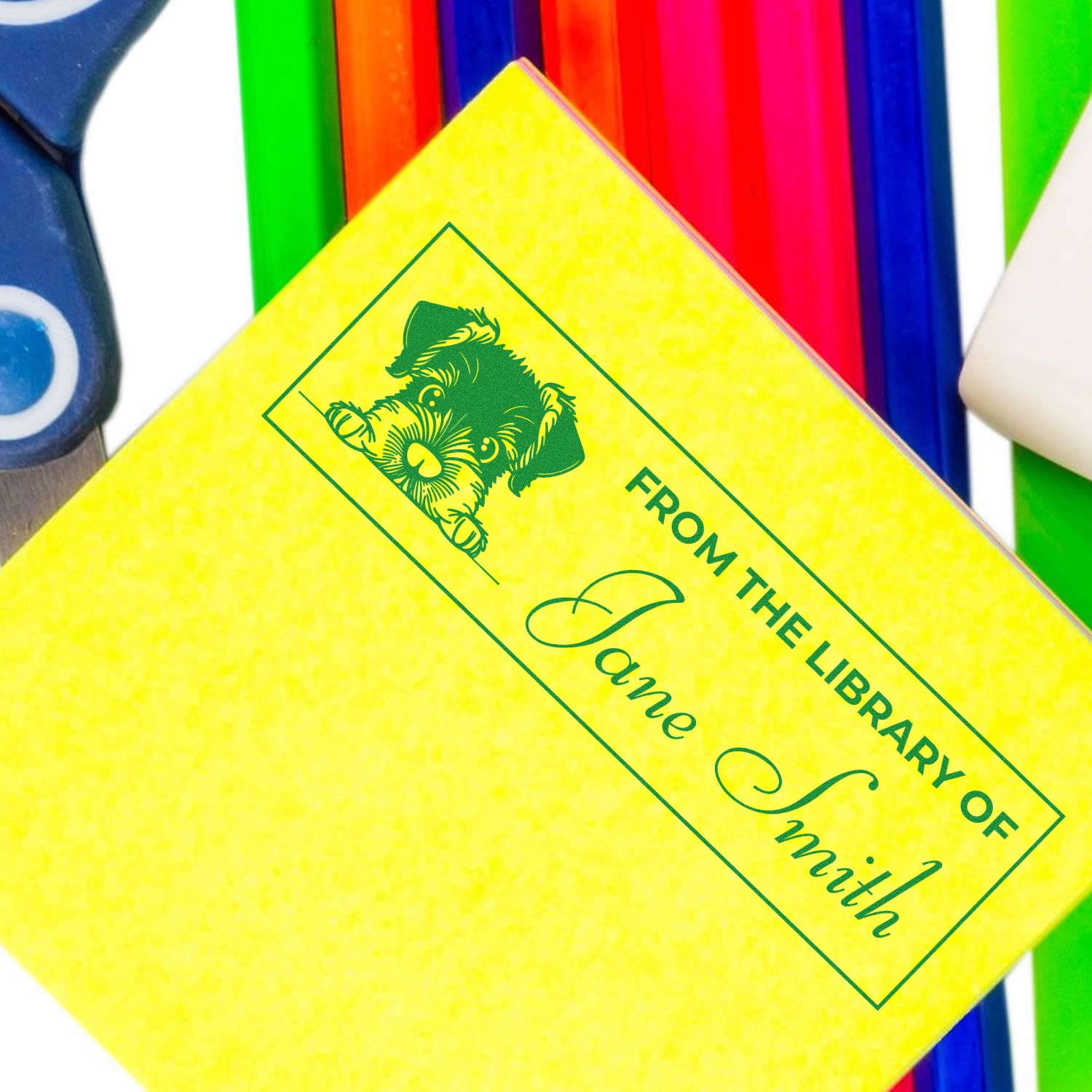 Custom rubber stamp reading From the Library of Jane Smith with dog design, ideal for personalized bookplates and stationery.