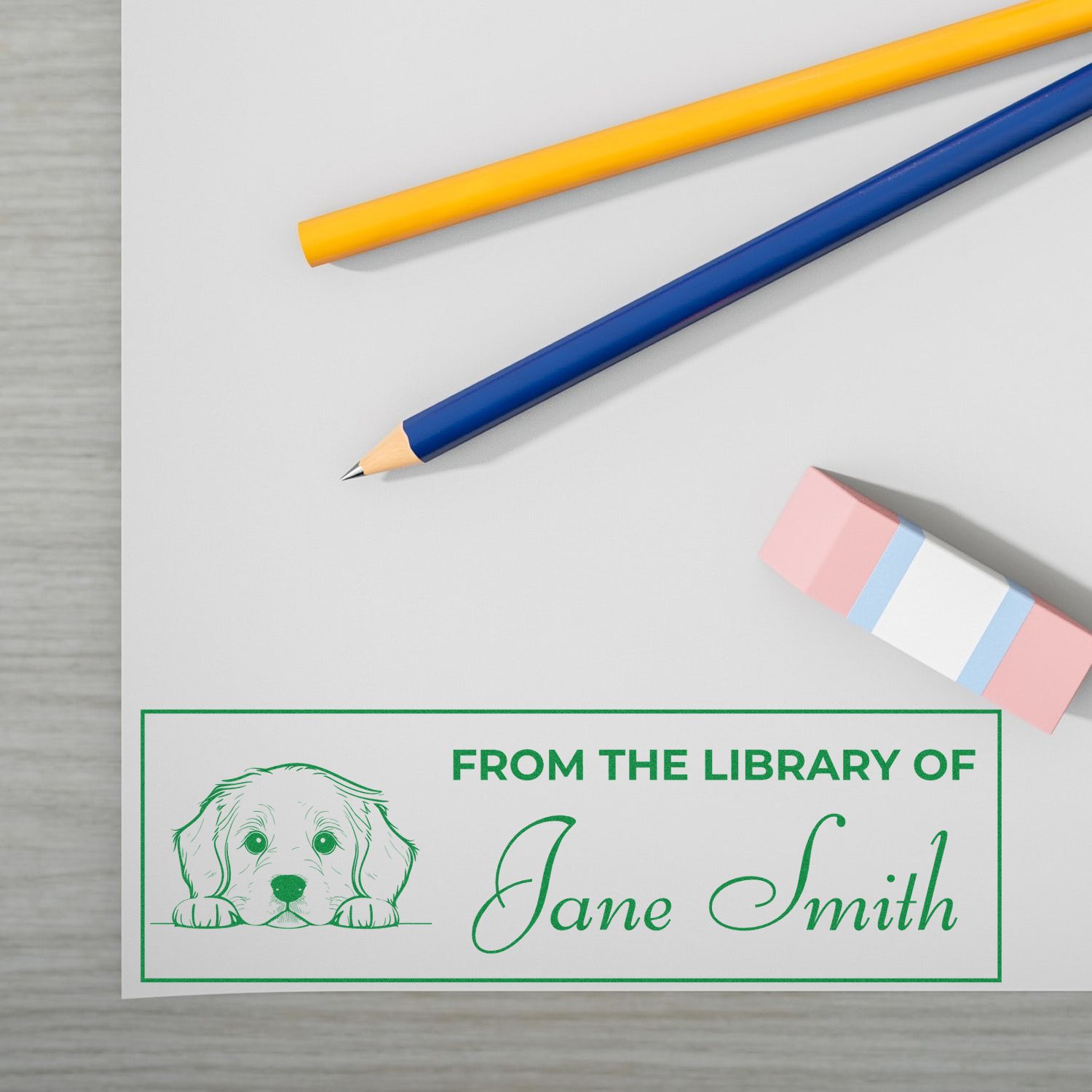 Custom library rubber stamp with dog illustration and From the Library of Jane Smith personalized book ownership design.
