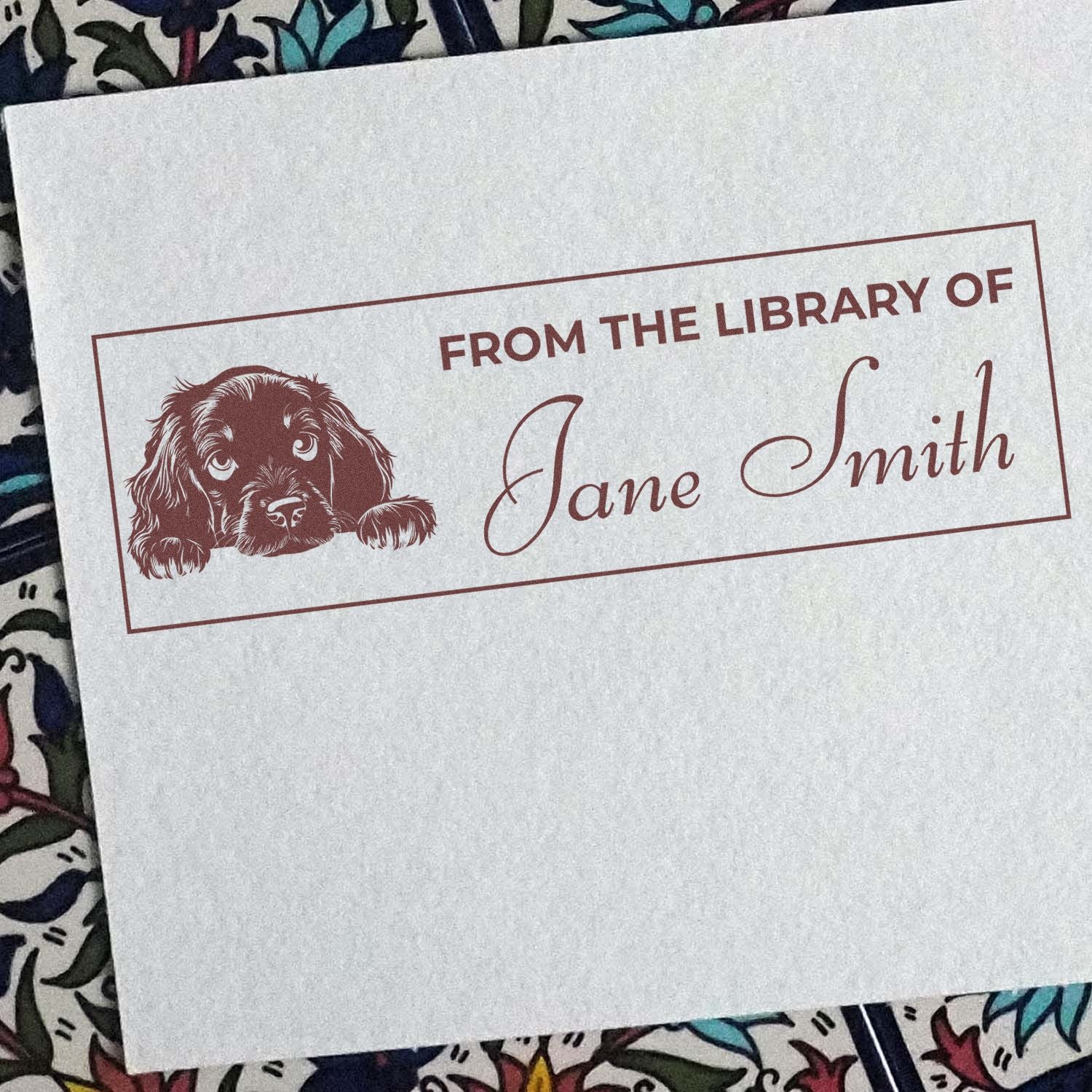 Custom rubber stamp for books reading From the Library of Jane Smith with dog illustration.
