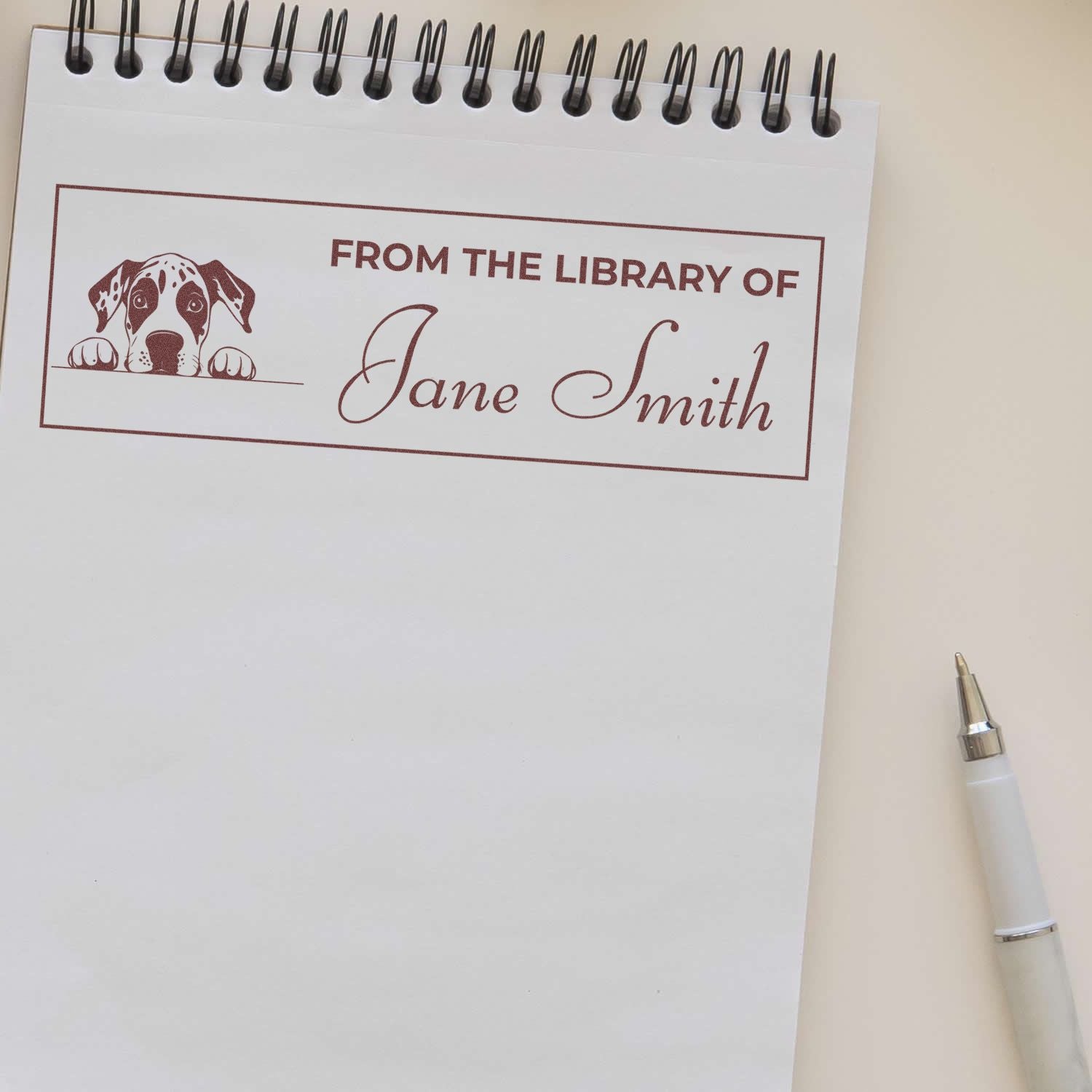 Personalized rubber stamp for books, reading From the Library of Jane Smith with dog illustration for custom bookplate use.