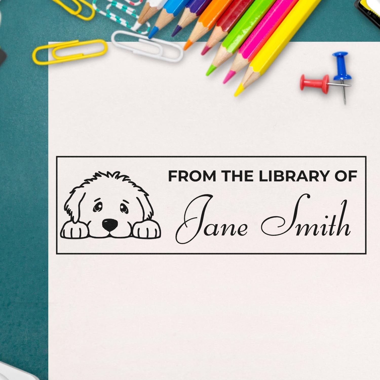Custom From the Library Of rubber stamp with dog illustration and personalized name for book lovers and teachers.