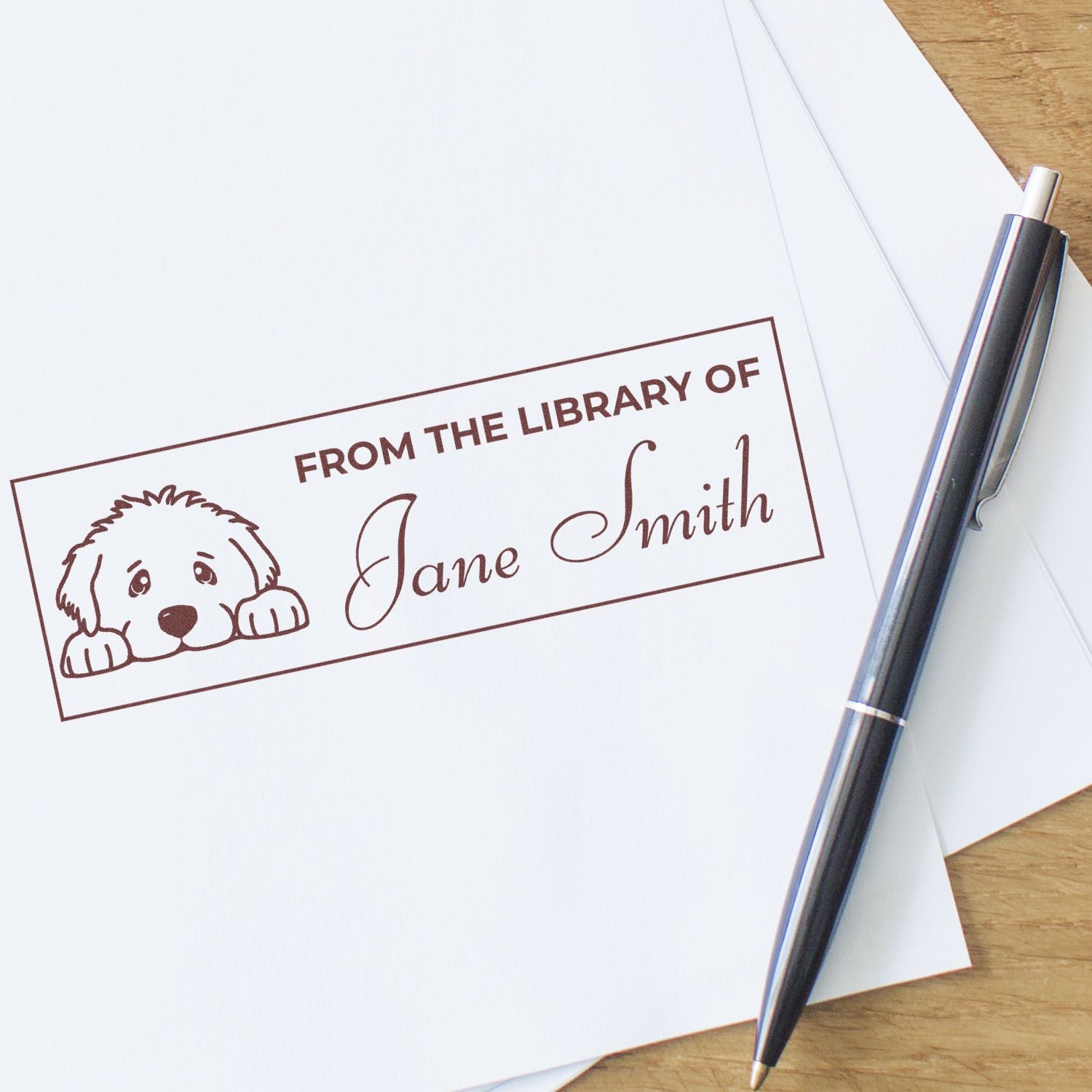 Custom dog-themed rubber stamp reading From the Library of Jane Smith for personalized book plates and stationery.