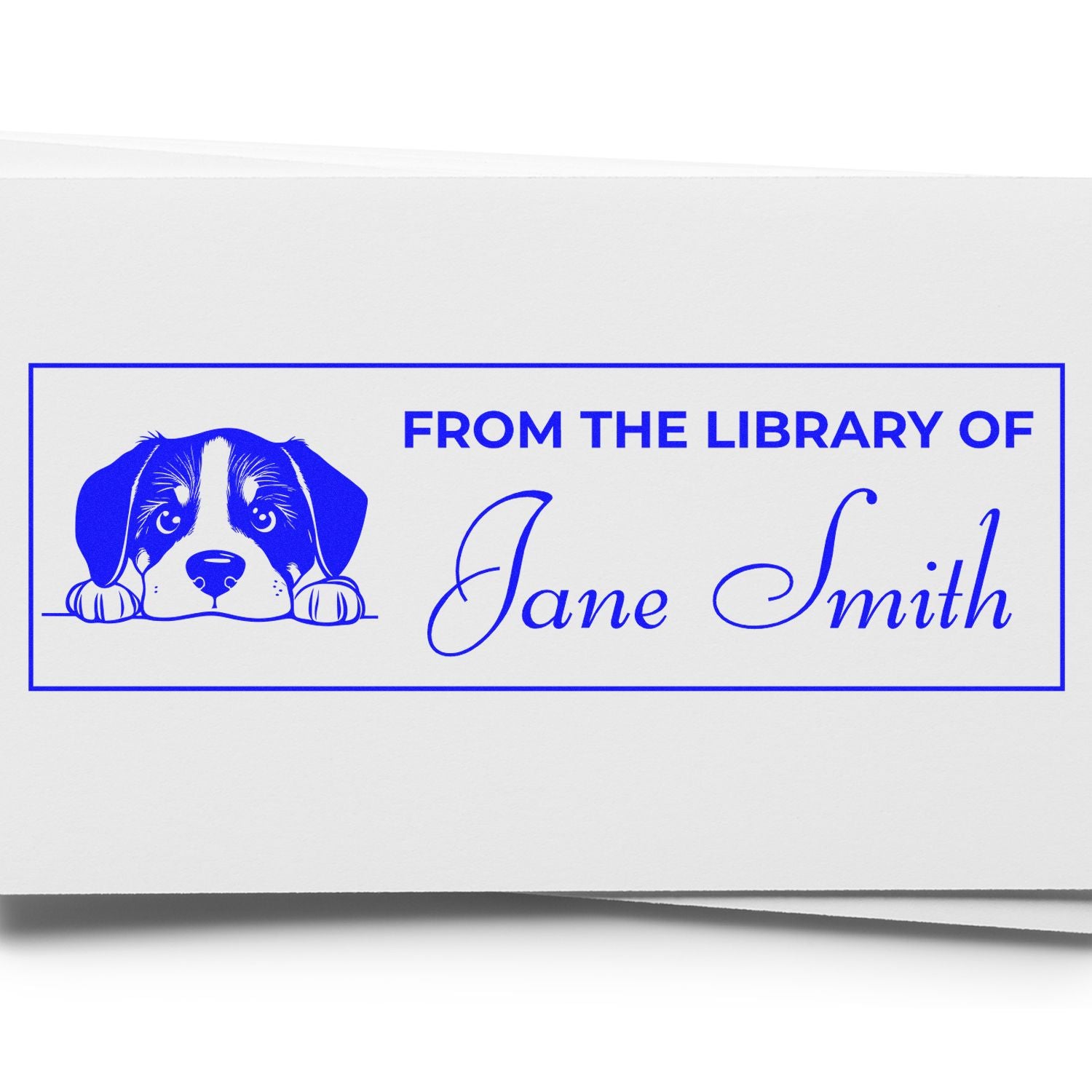 Custom dog-themed rubber stamp for books, reading From the Library of Jane Smith with puppy illustration.