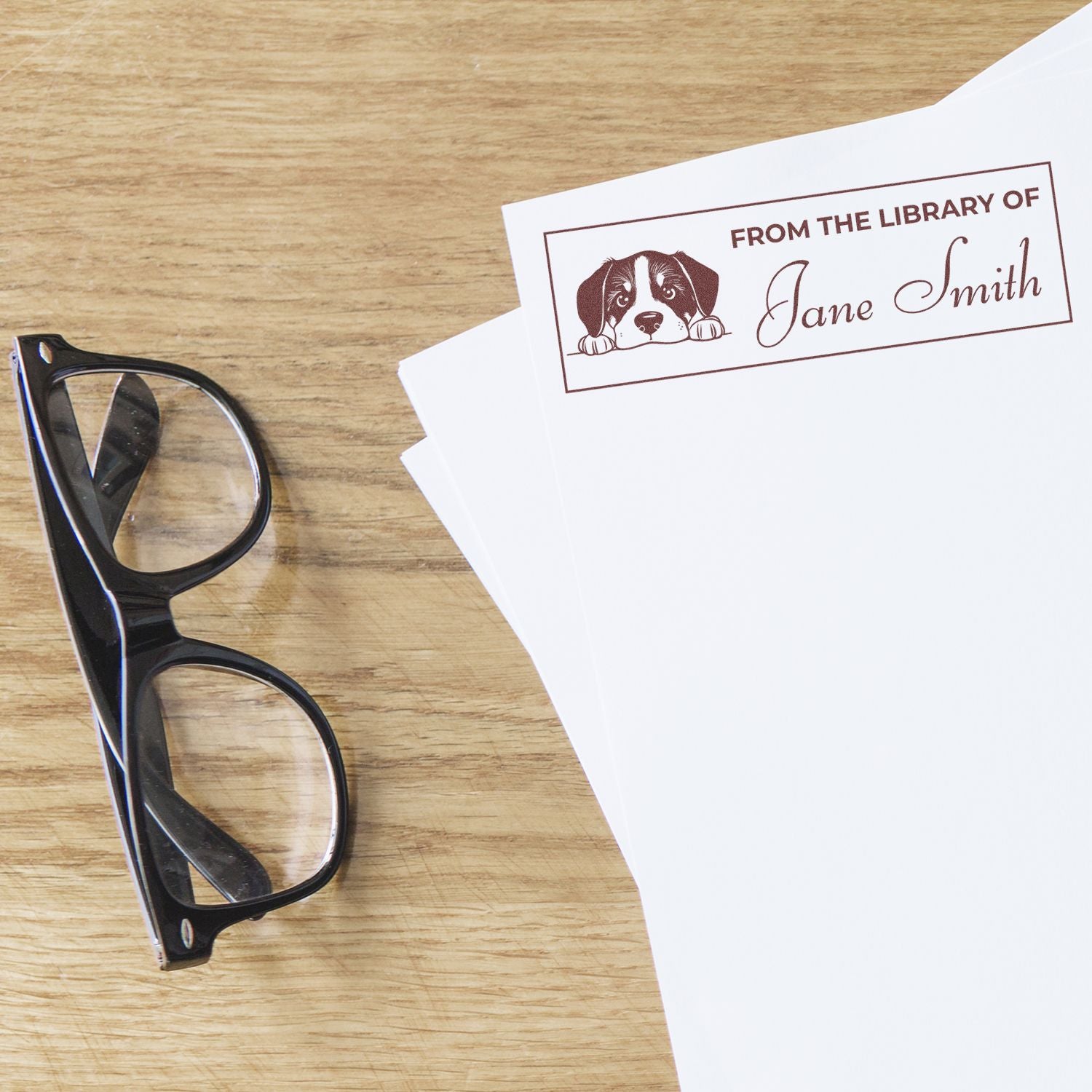 Custom library rubber stamp with dog bookplate design and personalized From the Library of Jane Smith imprint.