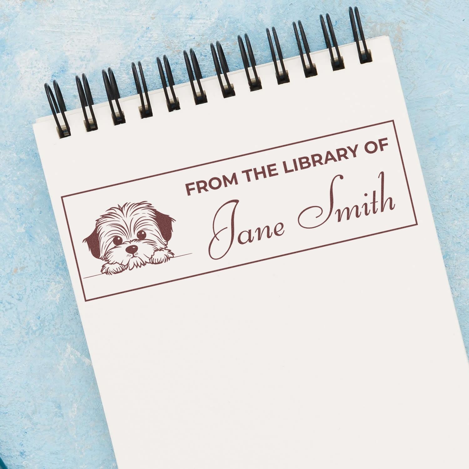 Custom book rubber stamp with dog illustration and From the Library of Jane Smith personalized book label.