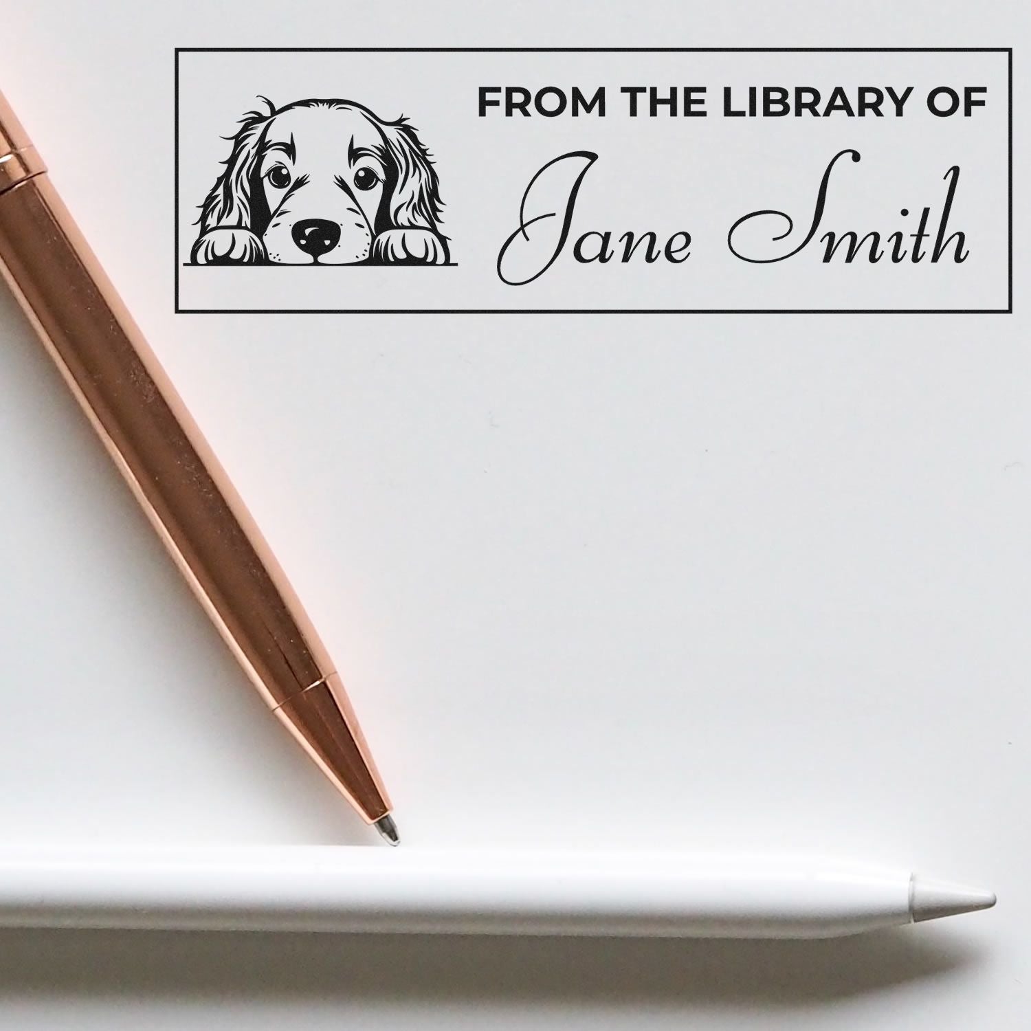 Personalized rubber library stamp with dog illustration and custom name, from the library of Jane Smith, for book ownership marking.