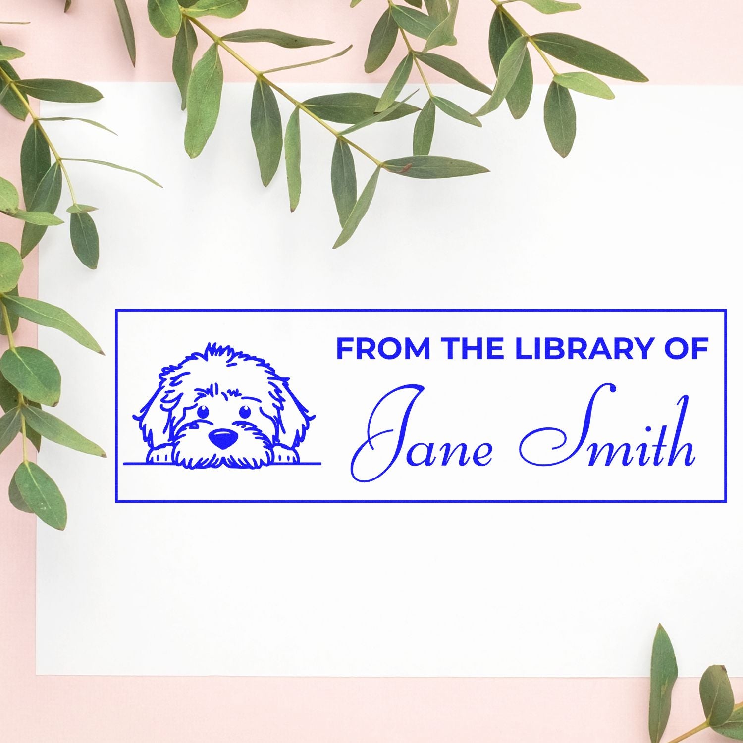 Personalized library rubber stamp with dog illustration and From the Library of Jane Smith text for books and stationery.