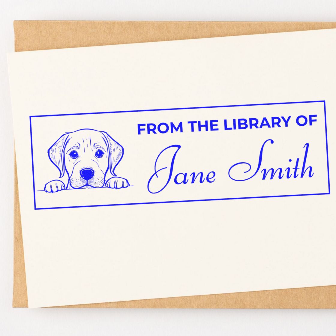 Custom library rubber stamp with dog illustration and From the Library of Jane Smith text for personal book labeling.