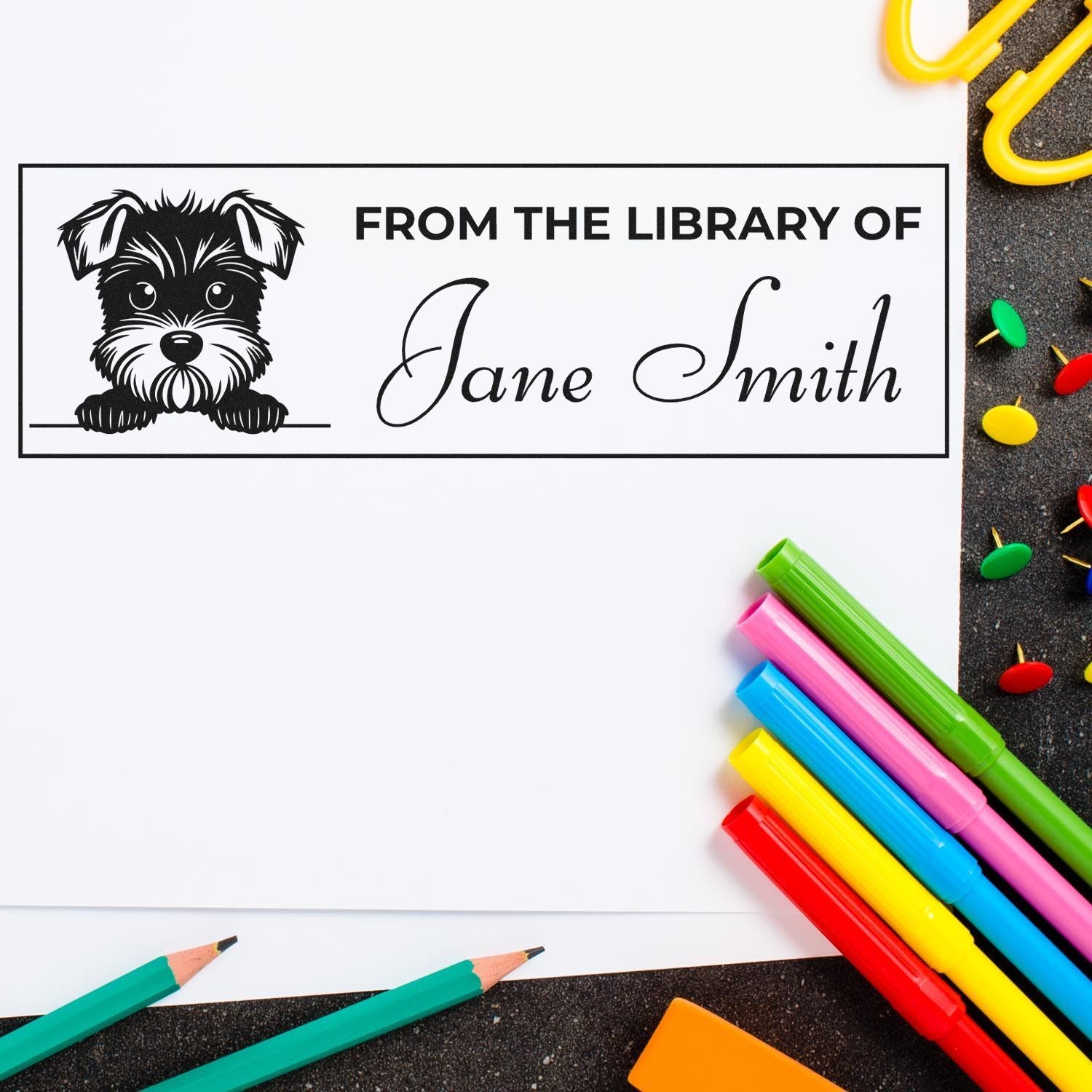 Personalized library book rubber stamp with dog illustration and From the Library of Jane Smith text.