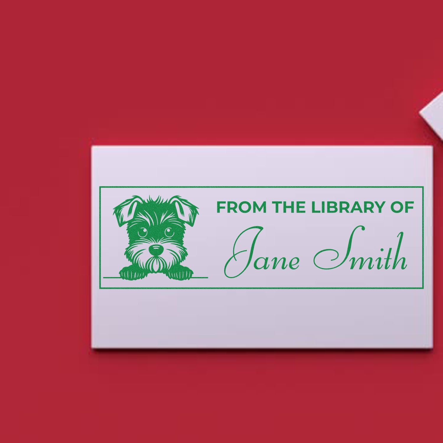 Personalized library rubber stamp with dog design and From the Library of Jane Smith for book ownership.
