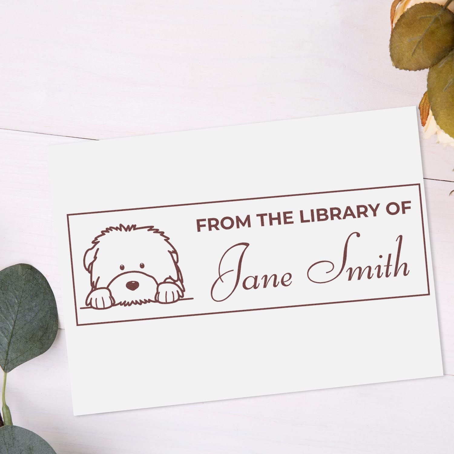 Custom rubber library stamp with dog illustration and personalized From the Library of Jane Smith book ownership text.