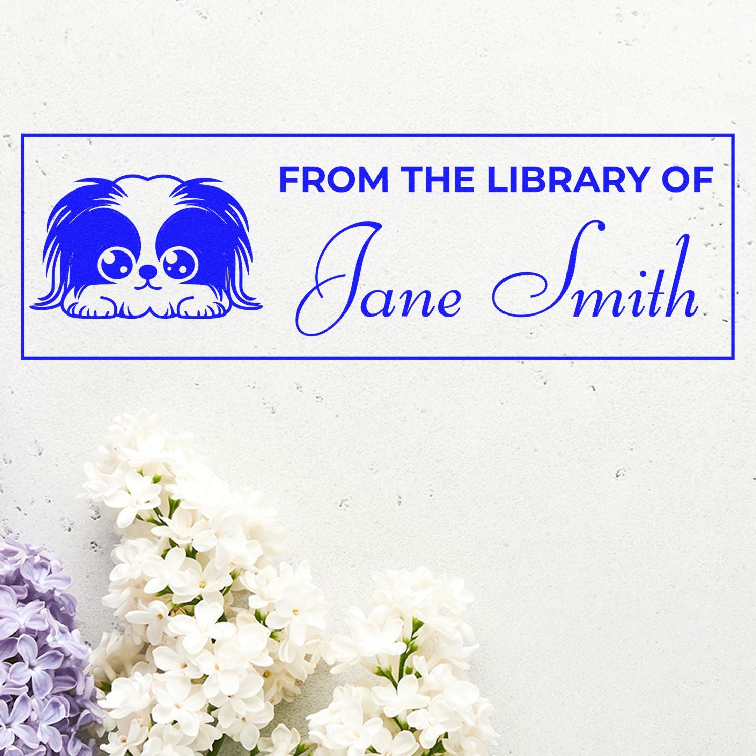 Custom rubber stamp with dog illustration and From the Library of Jane Smith for personal book labeling.