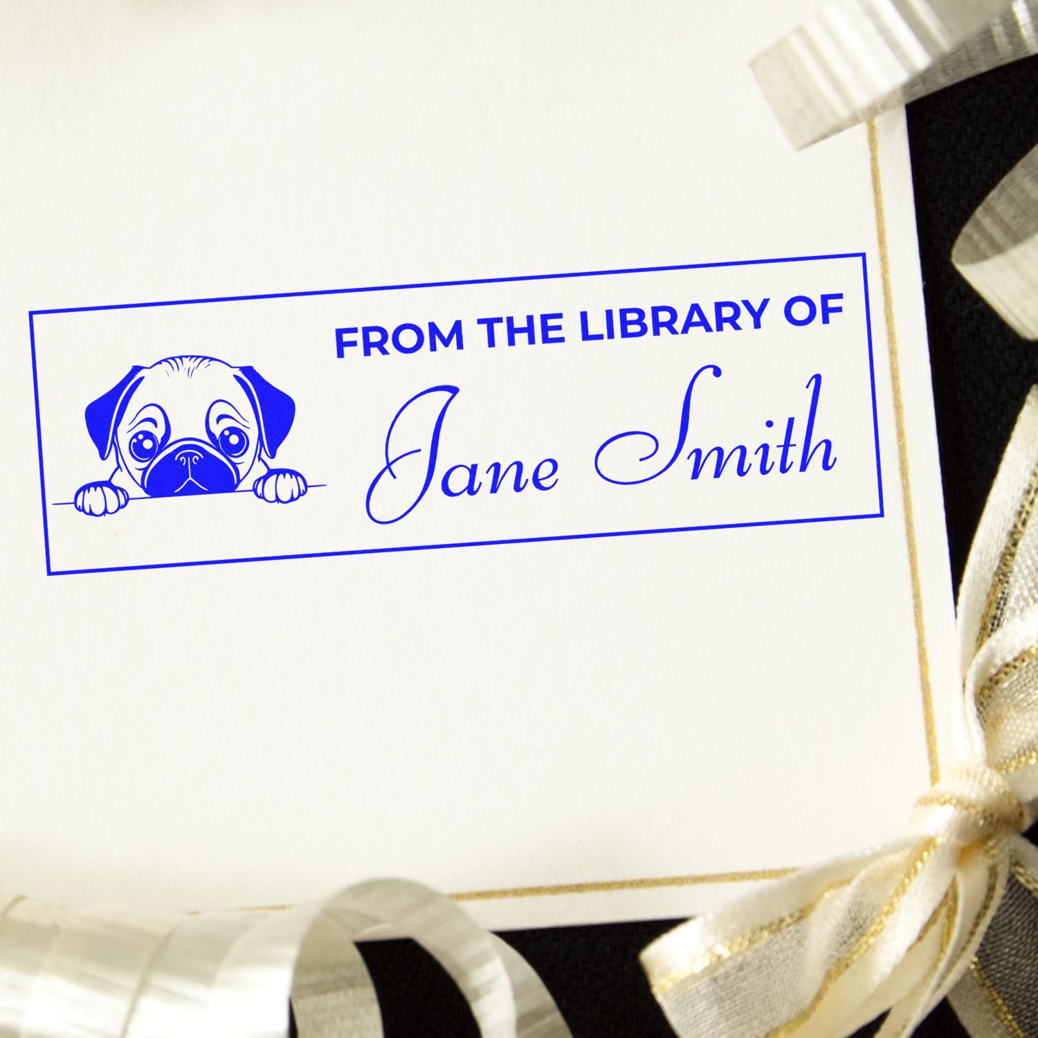 Custom rubber stamp bookplate with dog illustration and From the Library of Jane Smith text for personalized books.
