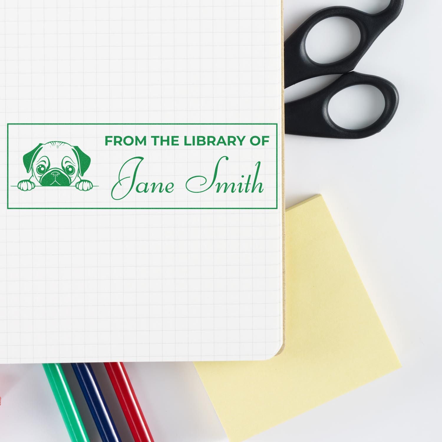 Personalized library rubber stamp with dog logo and Jane Smith name, used to label books and notebooks.