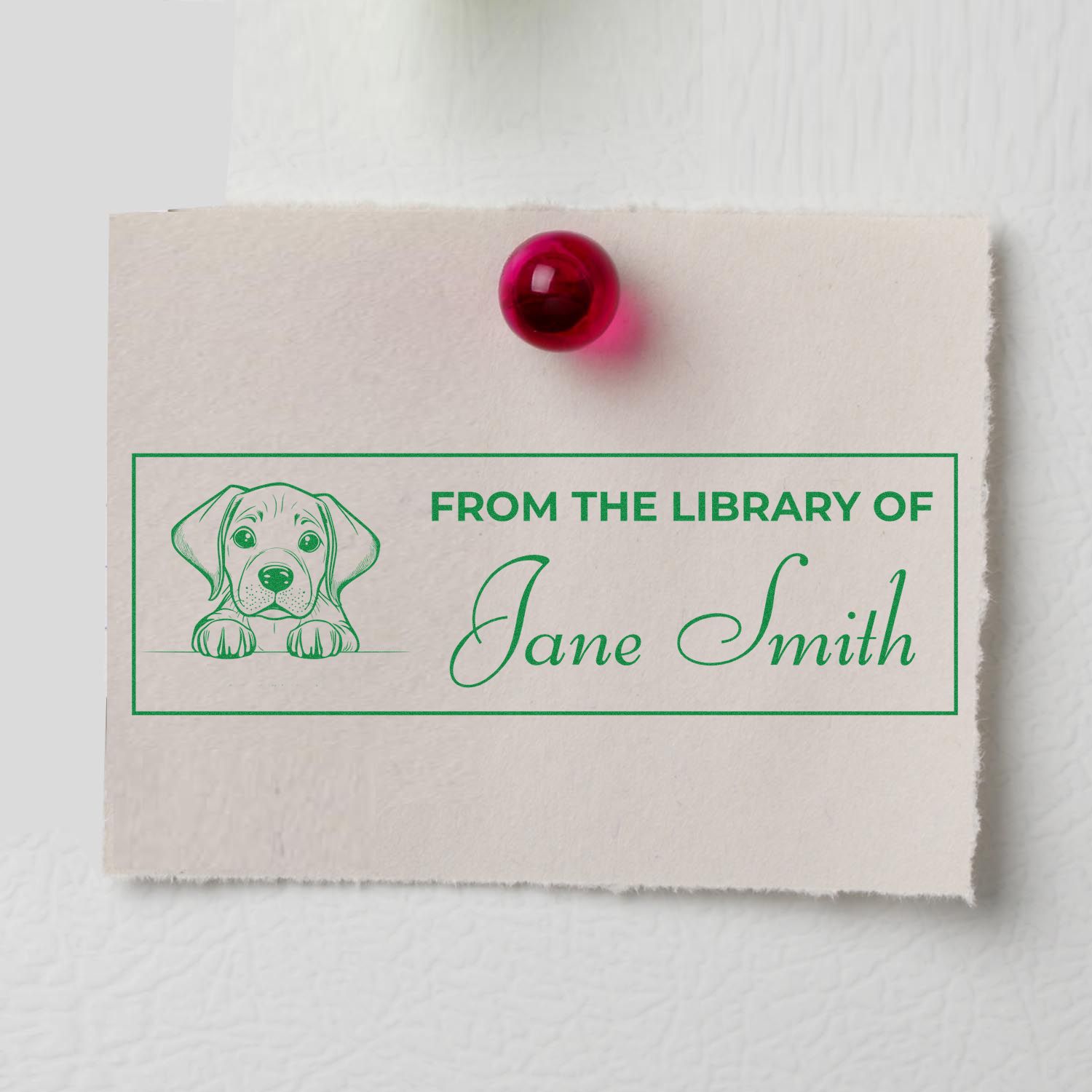 Custom personalized library rubber stamp with dog illustration and Jane Smith name for book ownership marking.