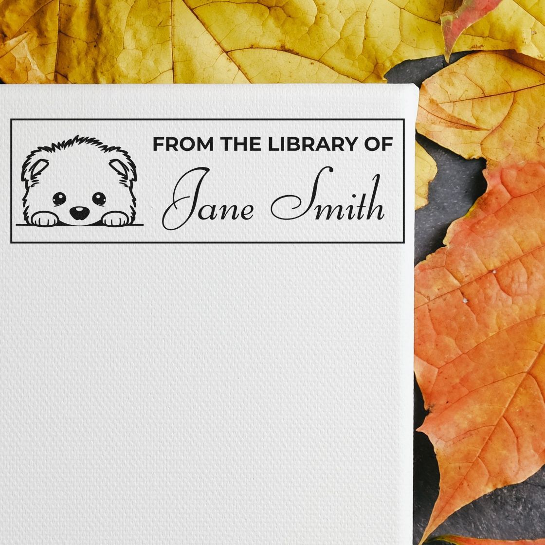 Custom From the Library of Jane Smith rubber stamp with dog illustration for personalized books and bookplates.