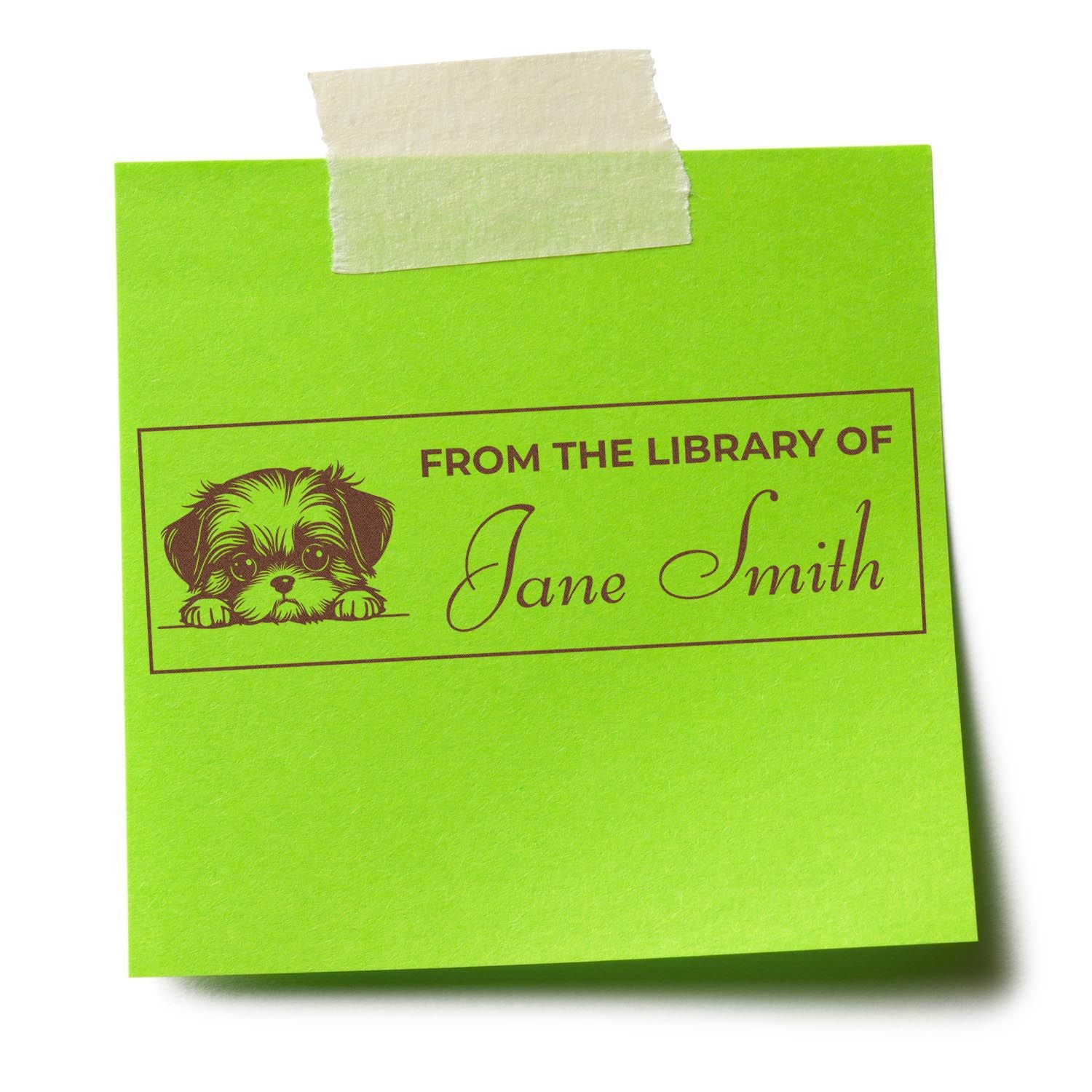 Personalized library rubber stamp reading From the Library of Jane Smith with puppy design on a green note.