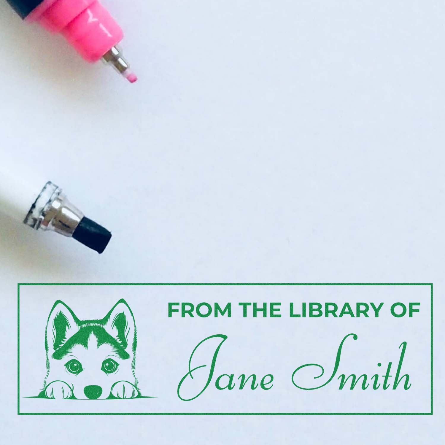 Custom library rubber stamp with husky design and From the Library of Jane Smith personalized book label.
