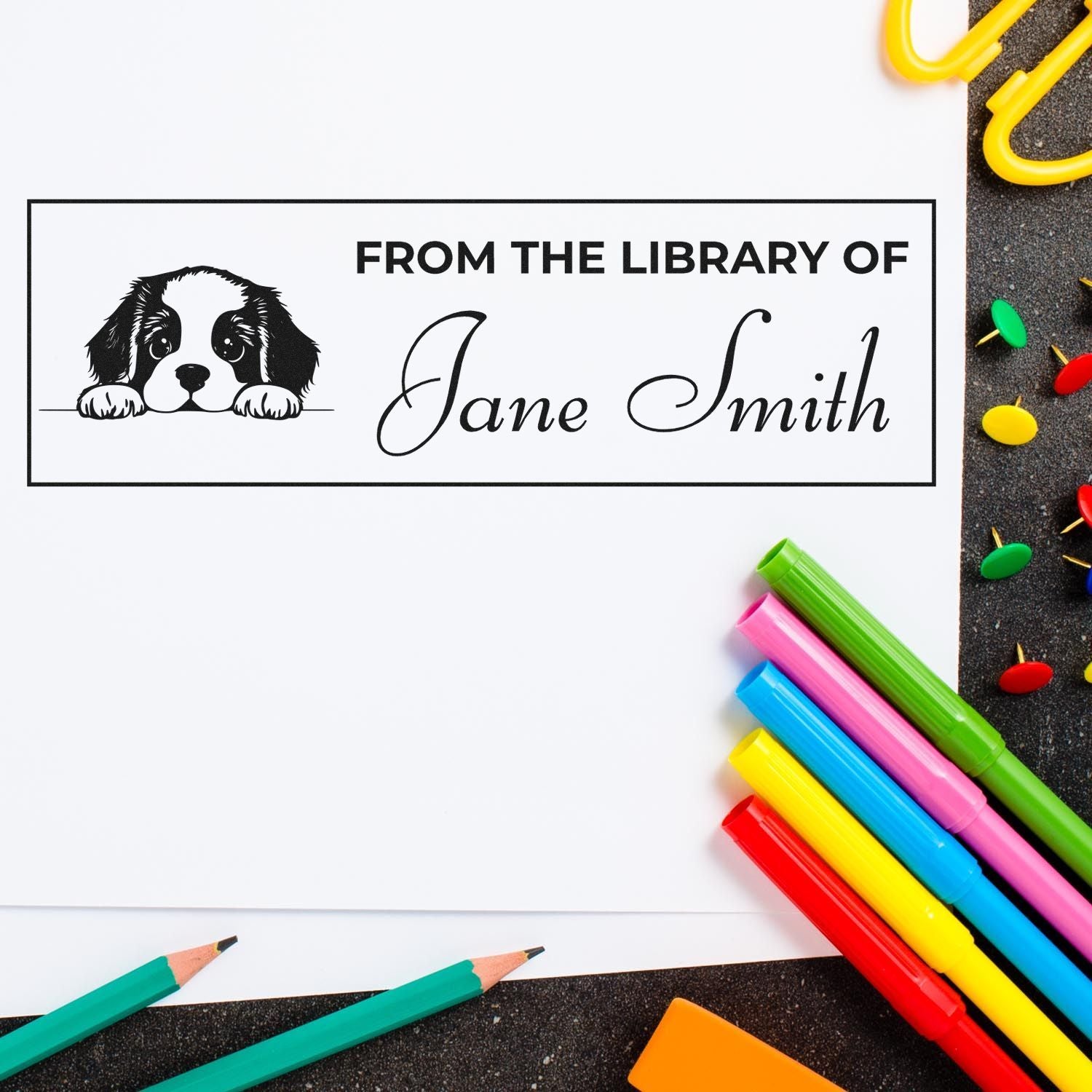 Custom rubber stamp design with puppy illustration and From the Library of Jane Smith text for personalized book labeling.