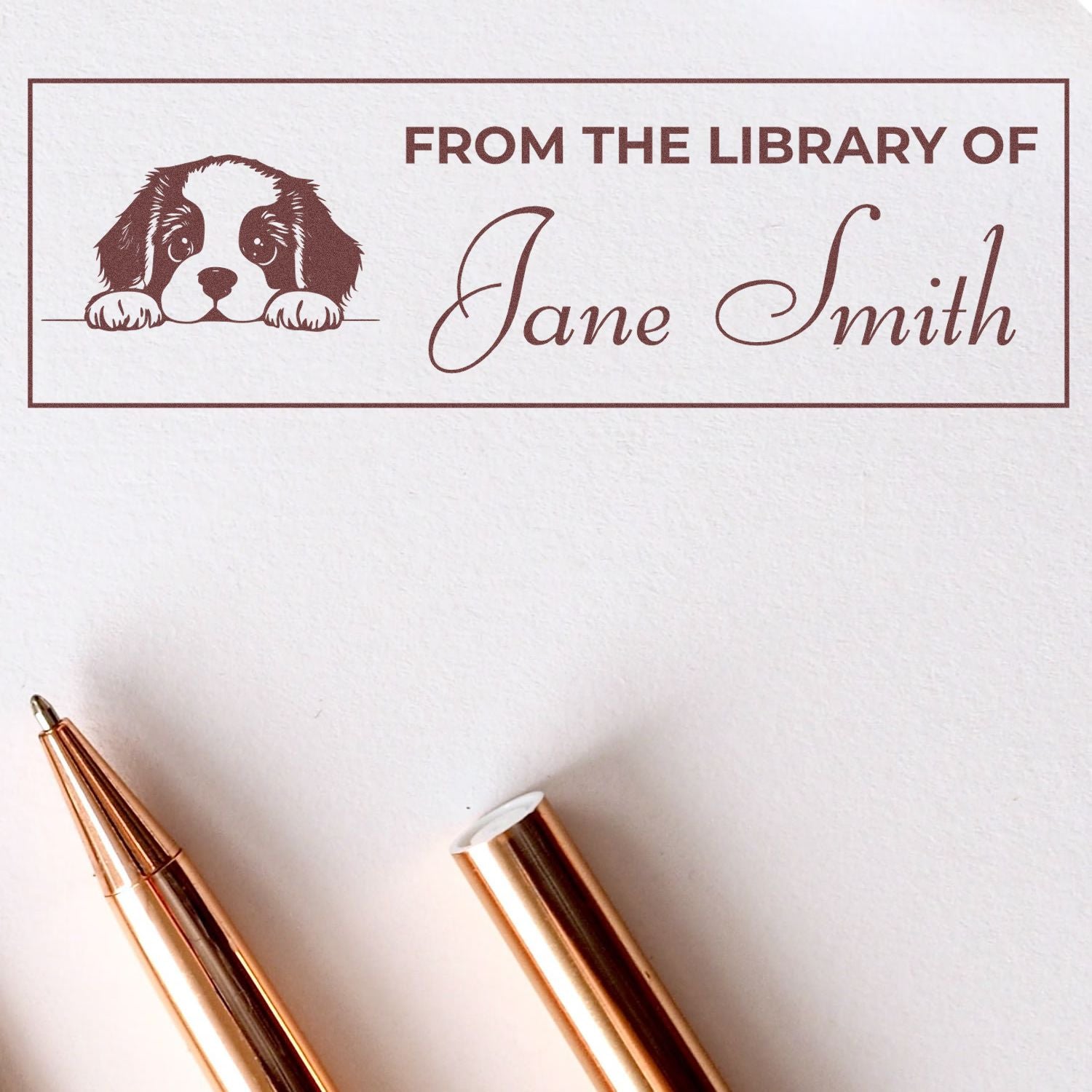 Custom rubber book stamp reading From the Library of Jane Smith with puppy design for personalized bookplates.