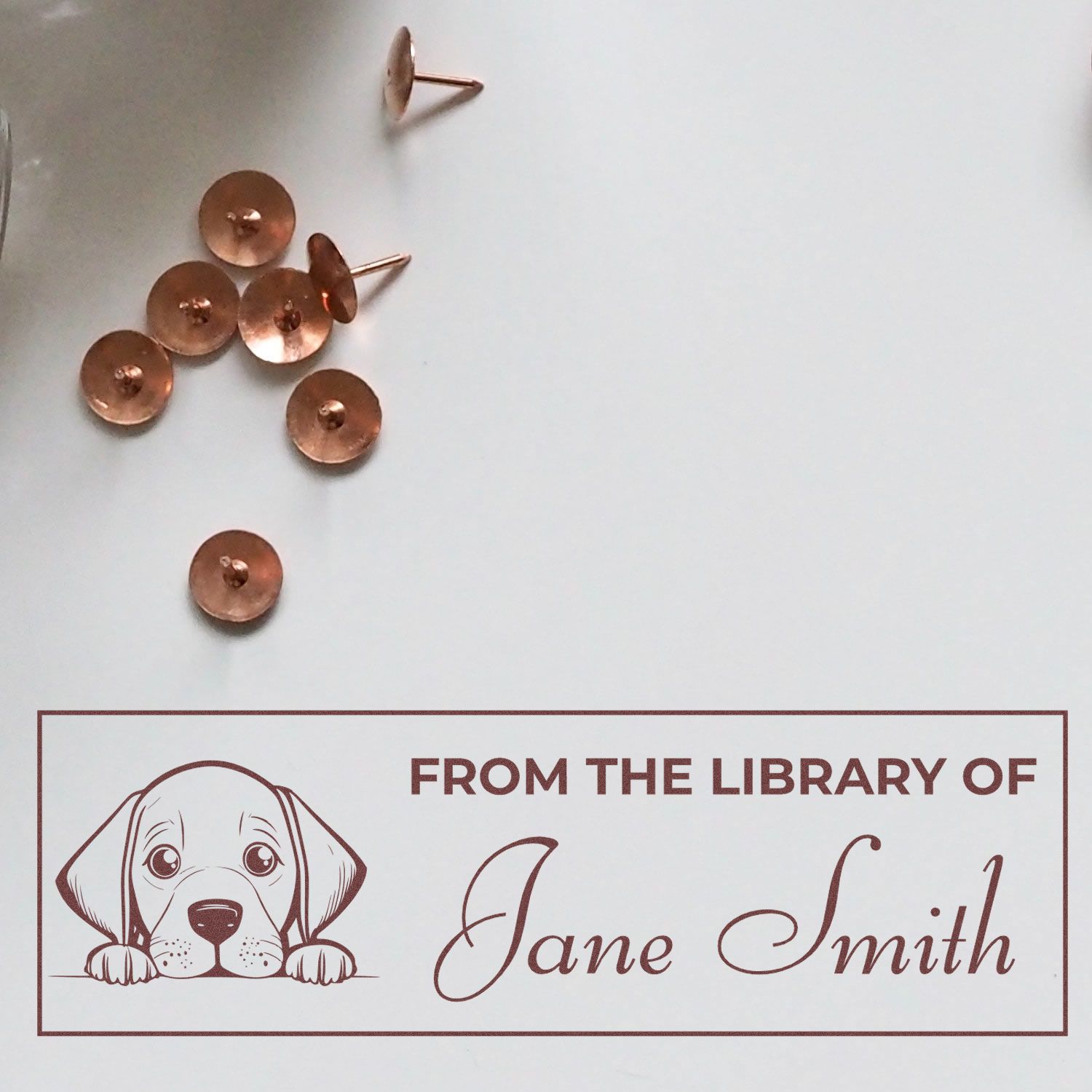 Personalized dog-themed library rubber stamp for books, reading From the Library of Jane Smith.