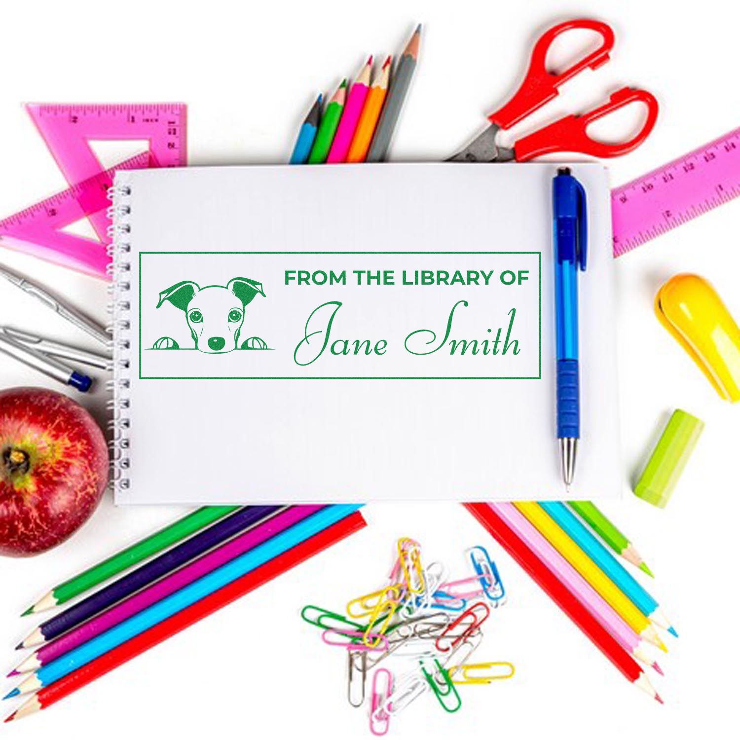 Custom personalized rubber stamp for books, featuring From the Library of Jane Smith with dog logo.